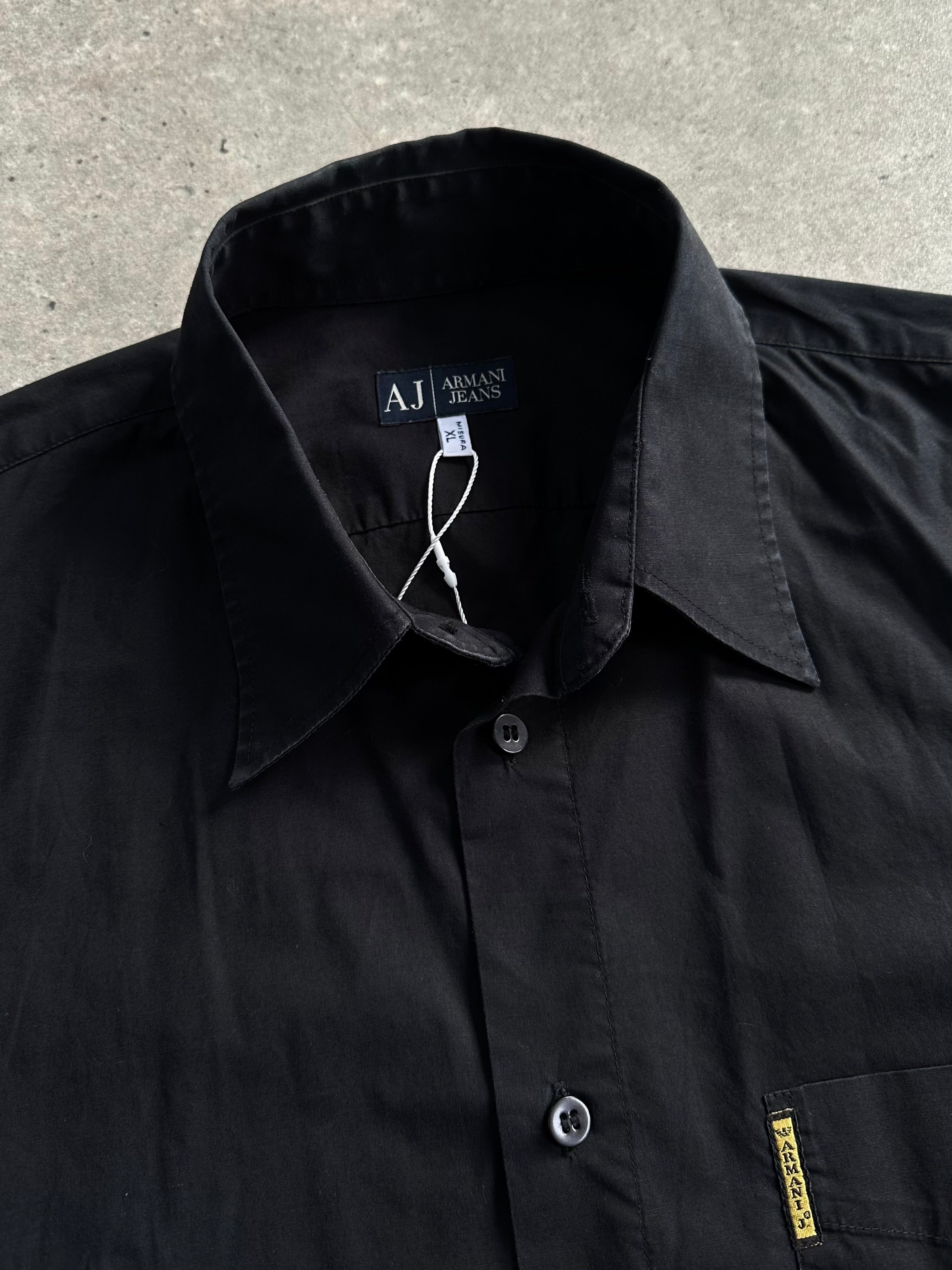 Armani Jeans cotton logo shirt in size L/XL, featuring a stylish design with the Armani logo on the front.