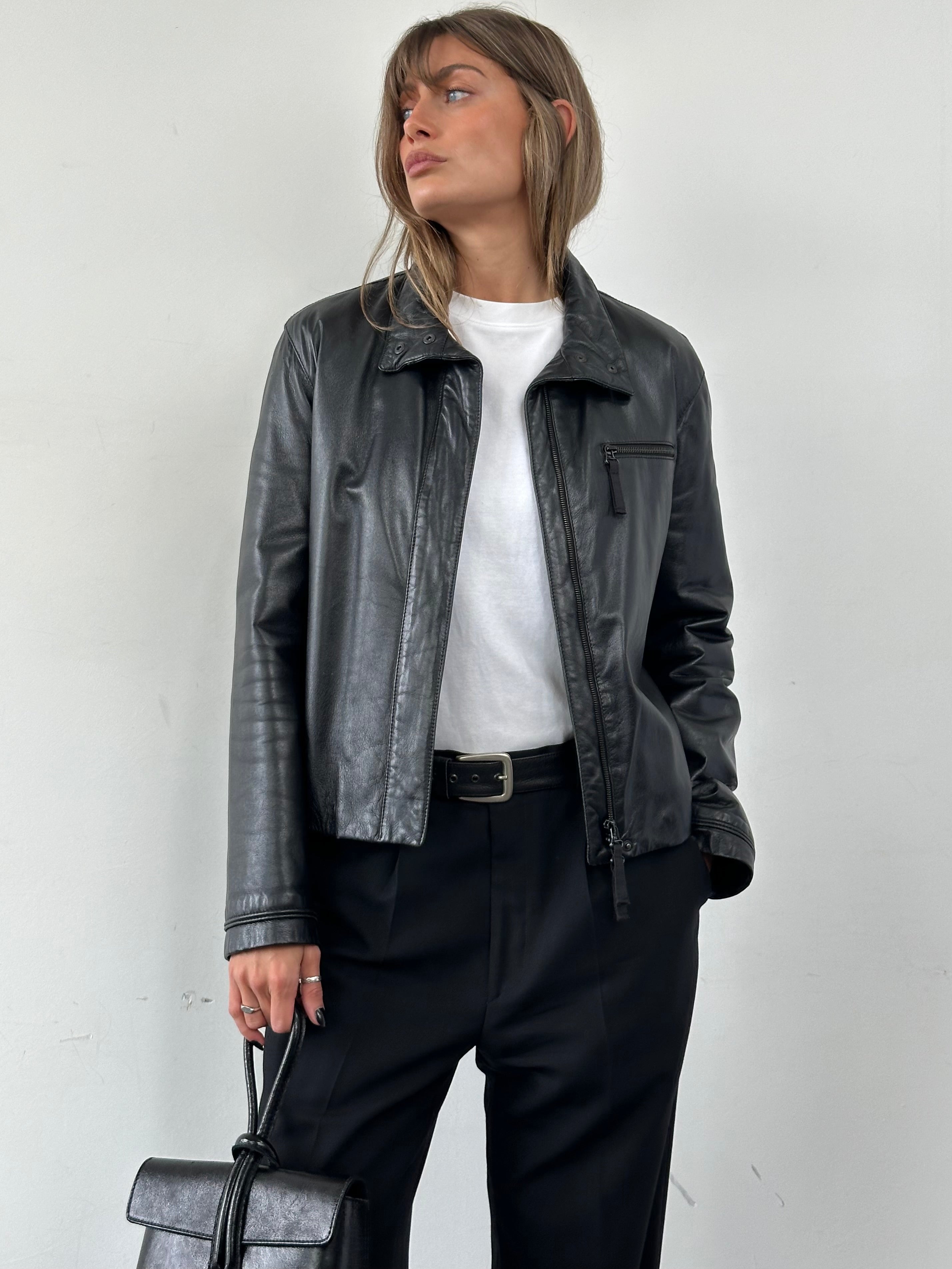 Armani Jeans double zip leather jacket in size M, featuring a sleek black design and silver hardware, displayed on a hanger.
