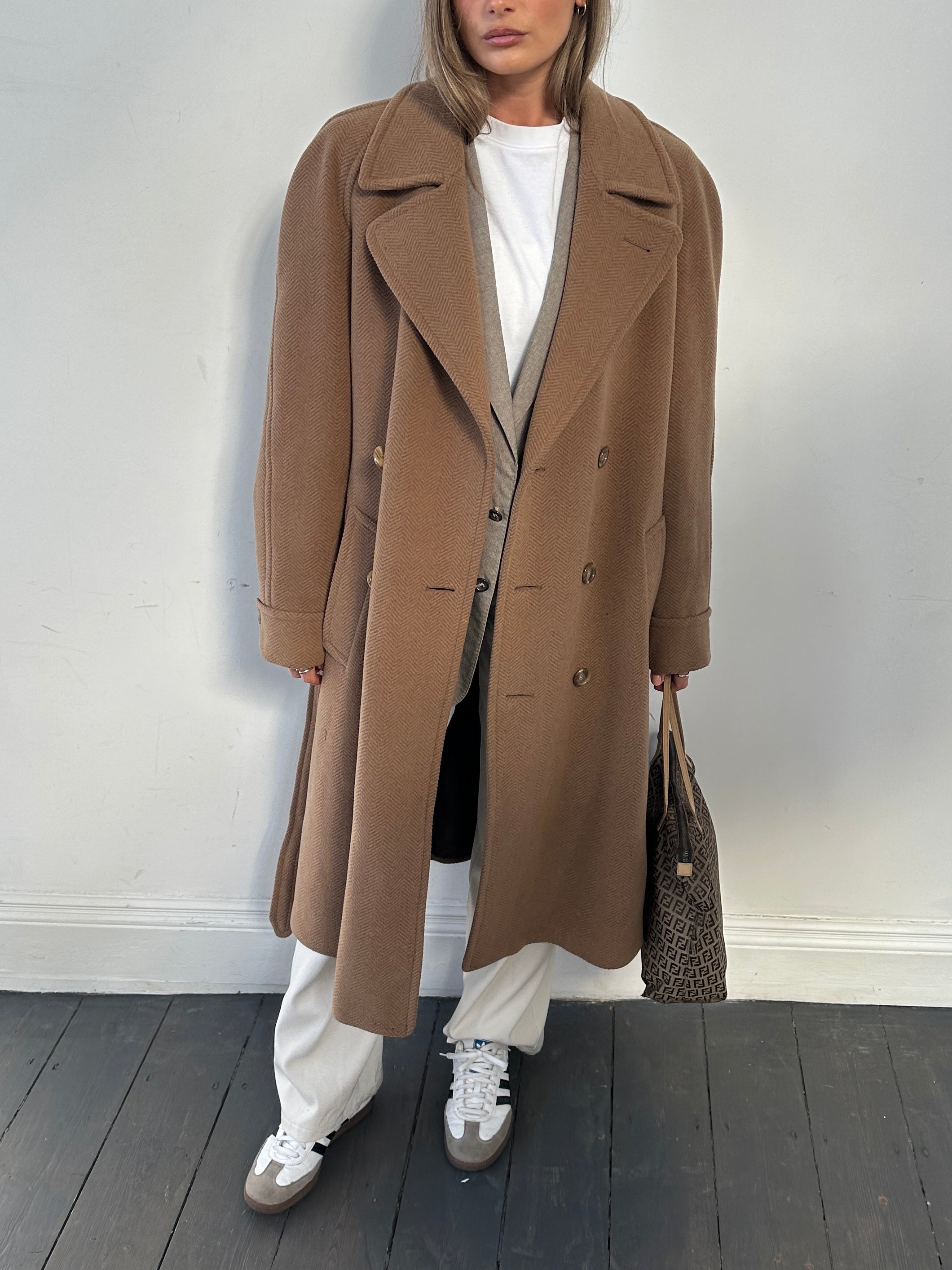 Christian Dior belted double-breasted wool coat in size L, featuring classic tailored design and elegant button details.