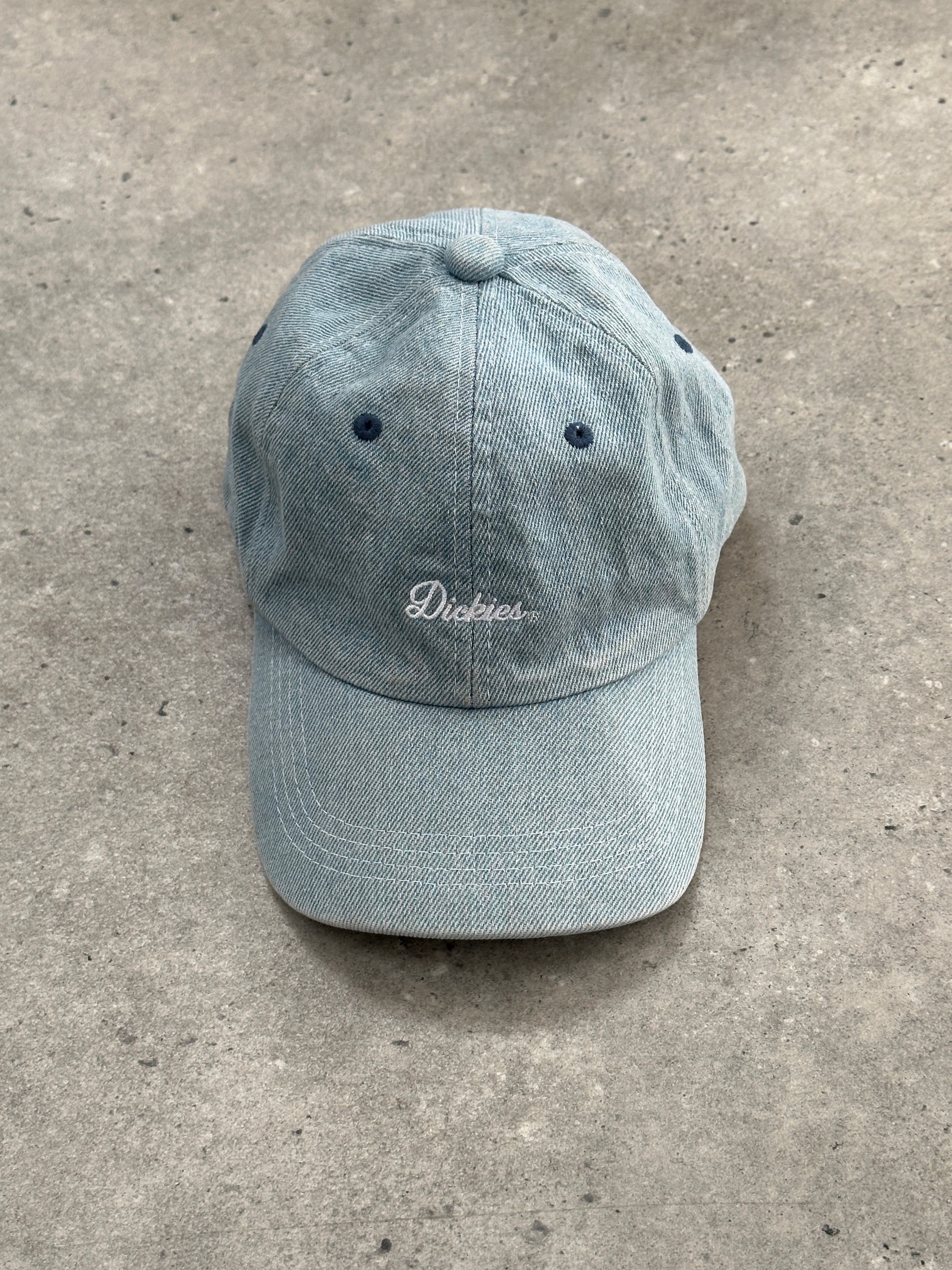 Dickies 2010s cotton denim logo cap showing front view with adjustable strap and embroidered Dickies logo in denim blue.