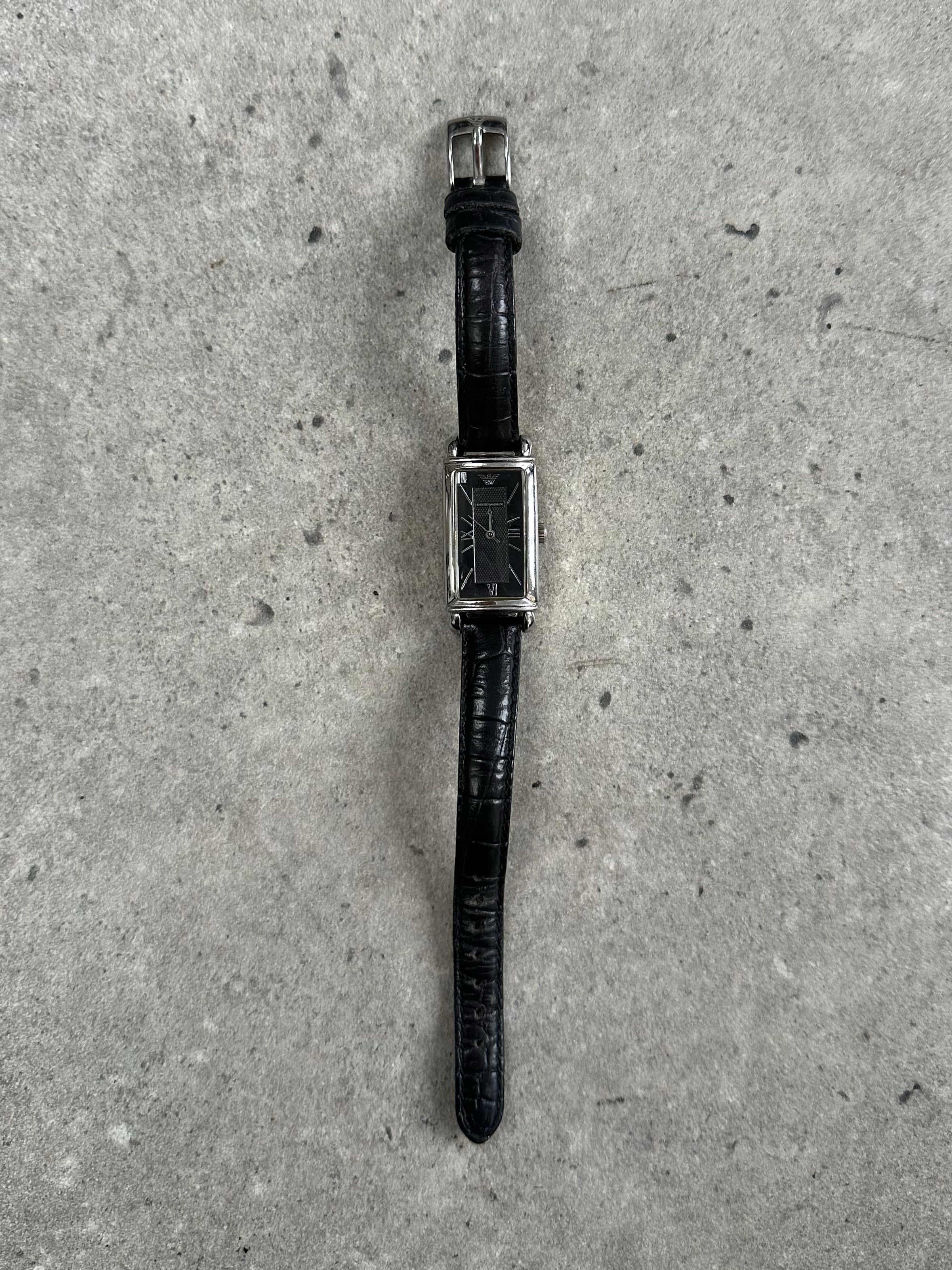 Emporio Armani 2000s leather watch with a round dial and leather strap, showcasing elegant and classic design details.