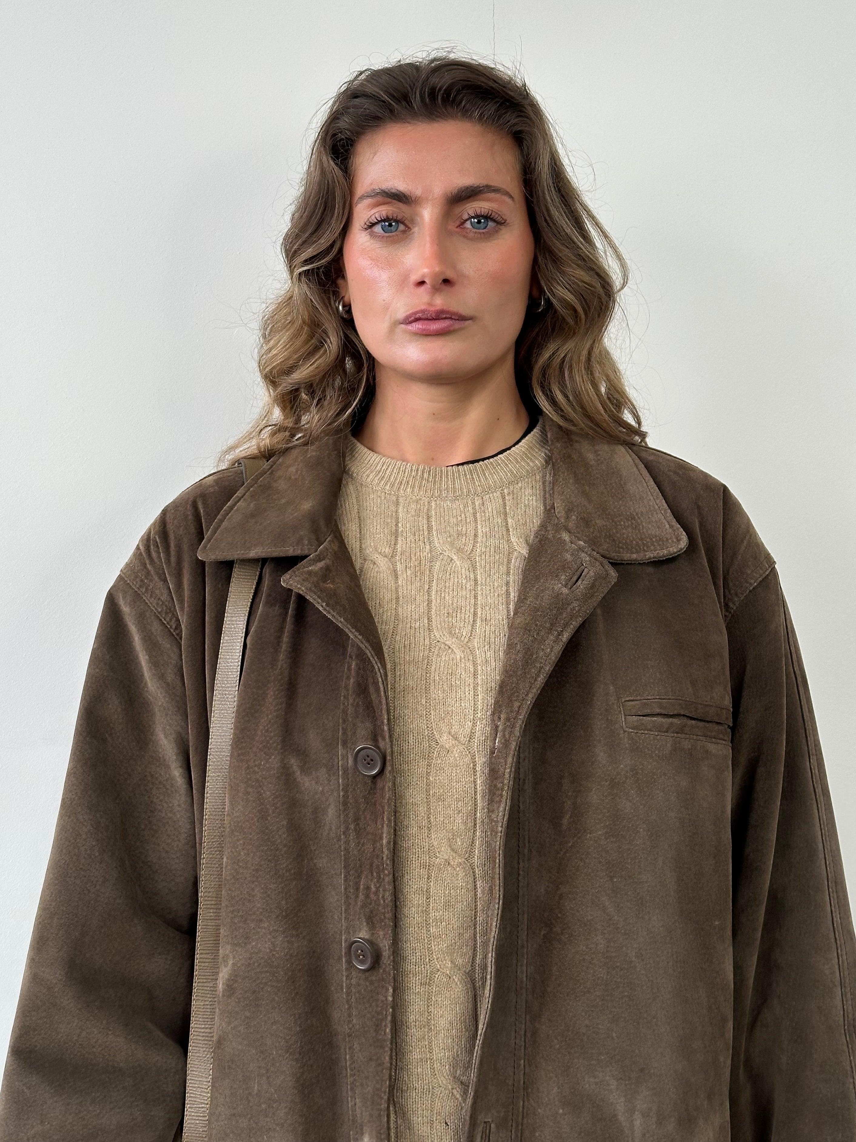 Vintage leather suede jacket in XL/XXL size with classic design and textured finish, displayed on a hanger.