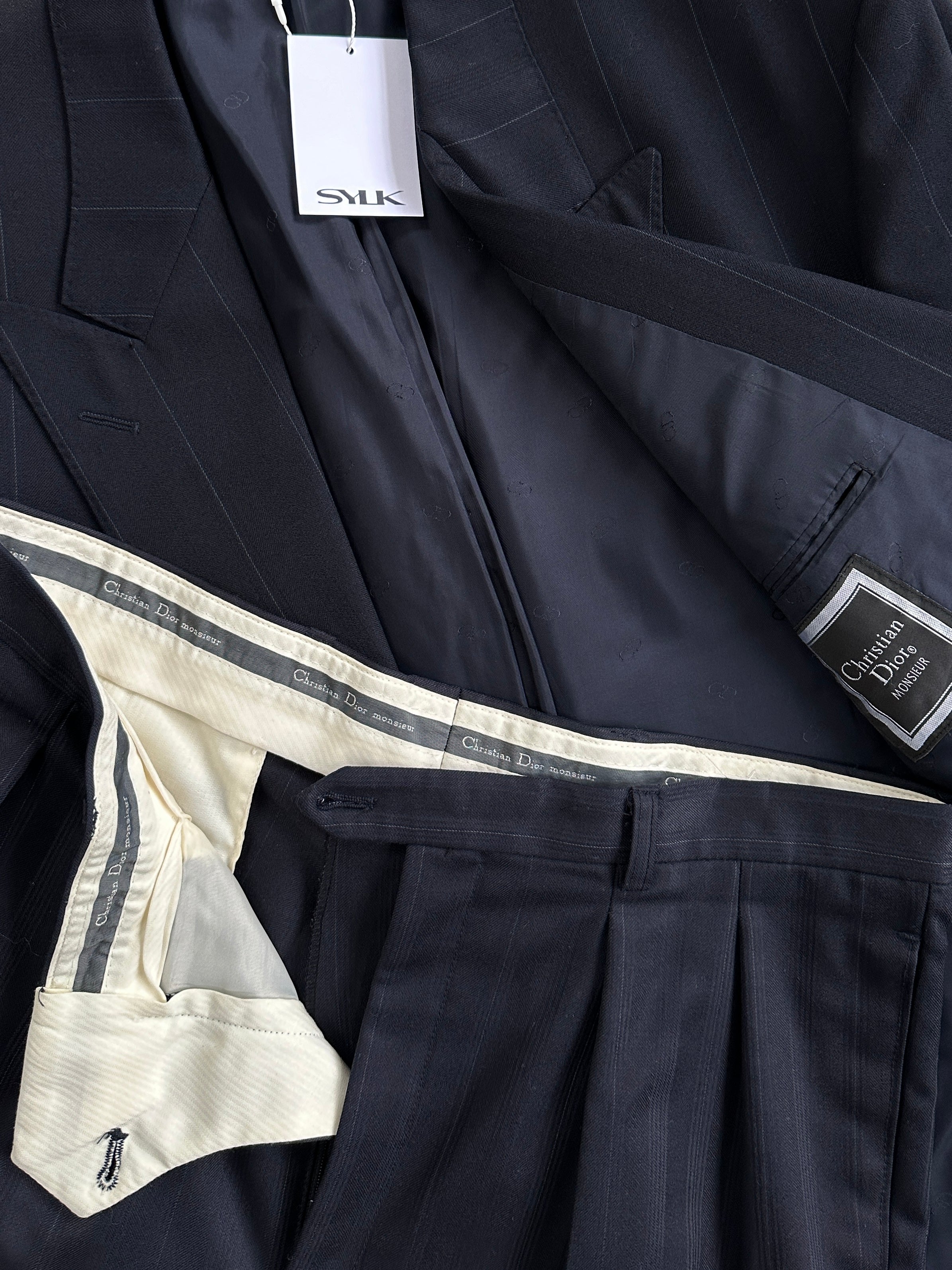 Christian Dior double-breasted wool jumpsuit with stripe pattern, size 42R/W32, featuring tailored lapels and button details.