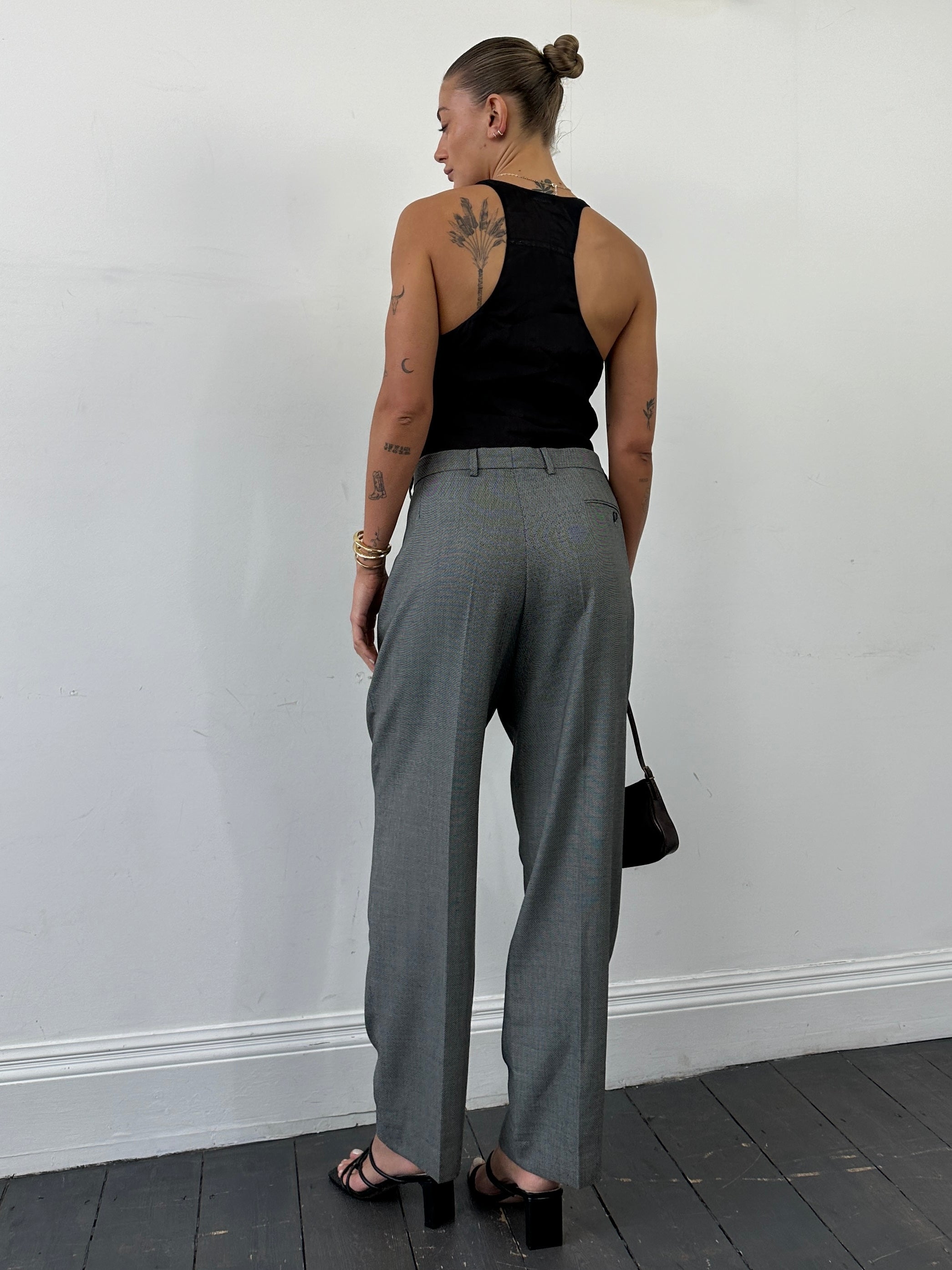 Yves Saint Laurent tailored high-waisted straight-leg trousers in black, W35, with clean lines and classic style.
