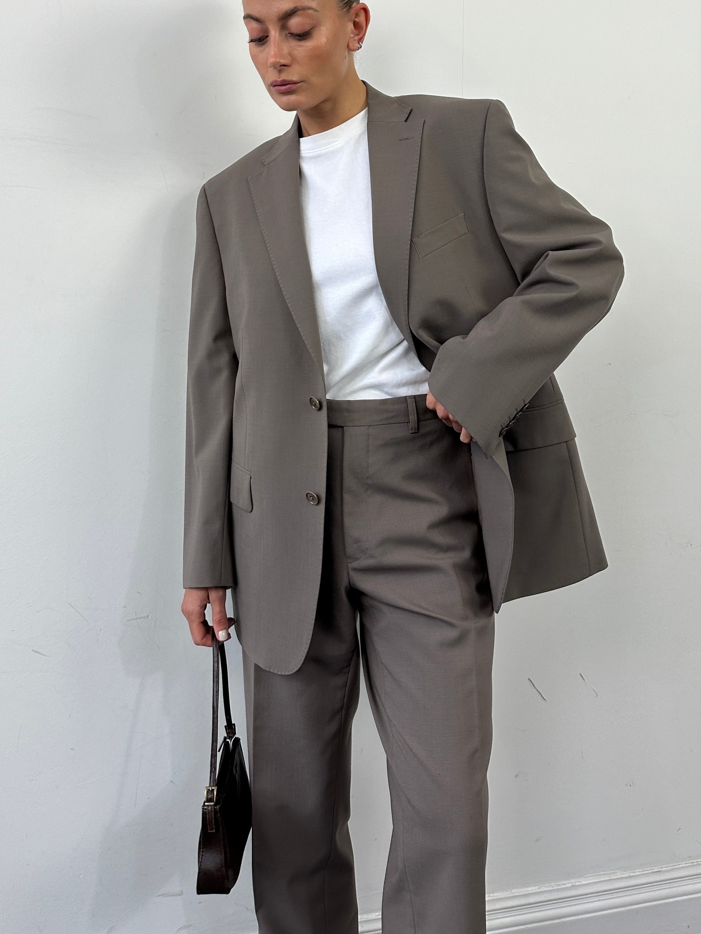 Vintage wool single-breasted jumpsuit in size 42S/W34, featuring a classic vintage suit style with tailored fit and lapels.