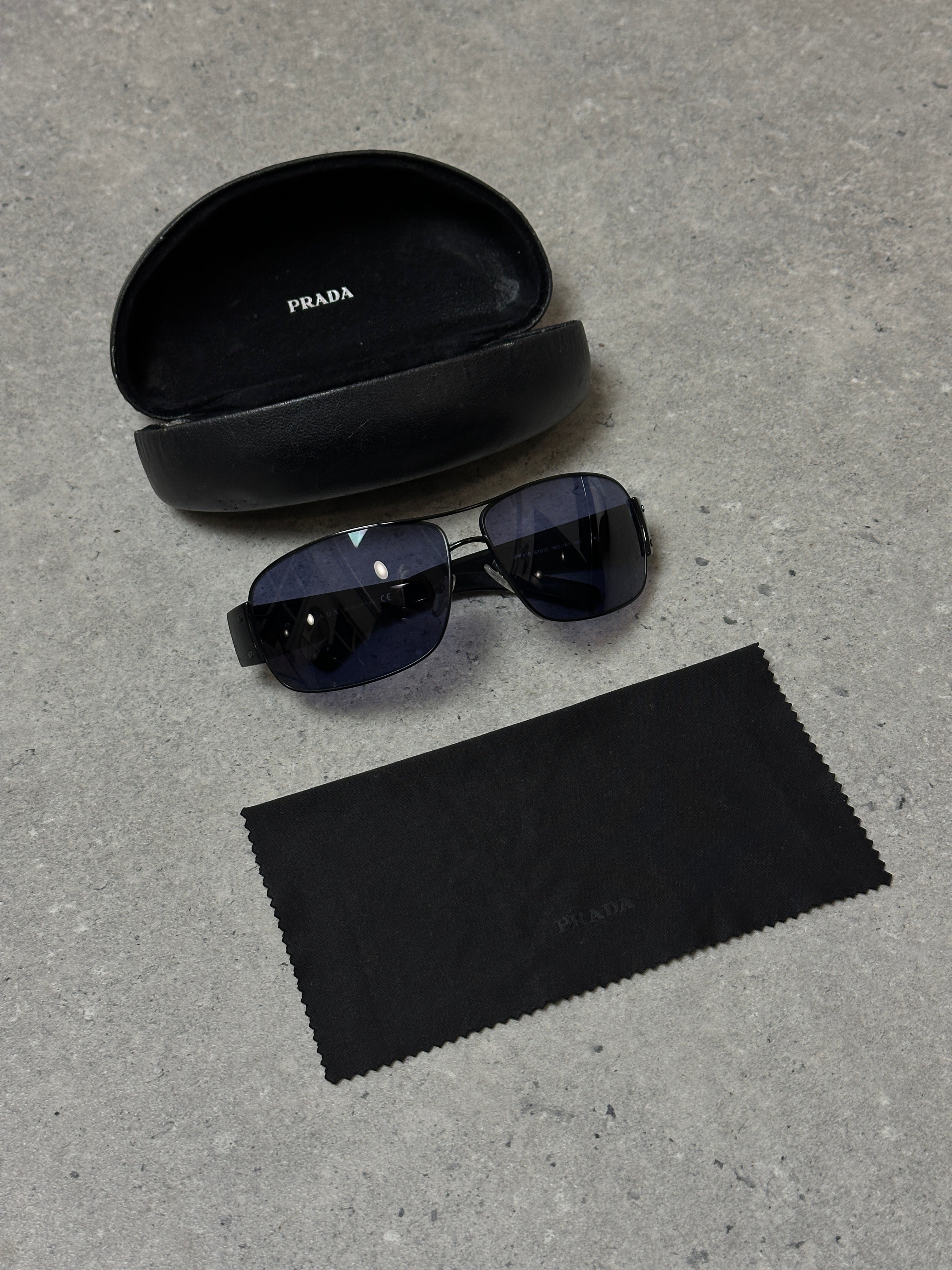 Prada aviator shield sunglasses with large tinted lenses and metal frame, stylish and protective eyewear.