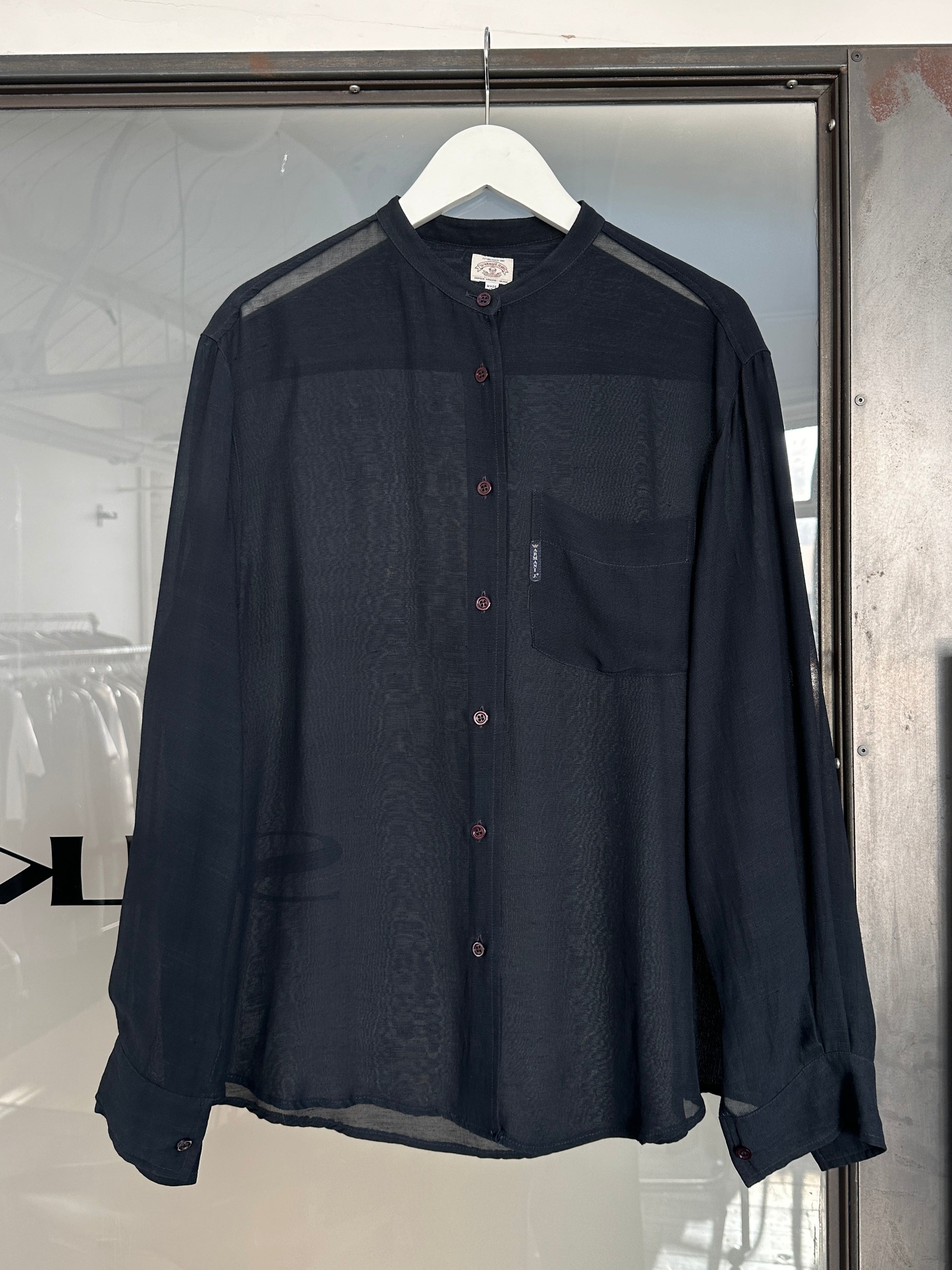 Armani Jeans 1990s sheer shirt in size M, lightweight fabric with a semi-transparent, vintage-inspired design displayed on a hanger.