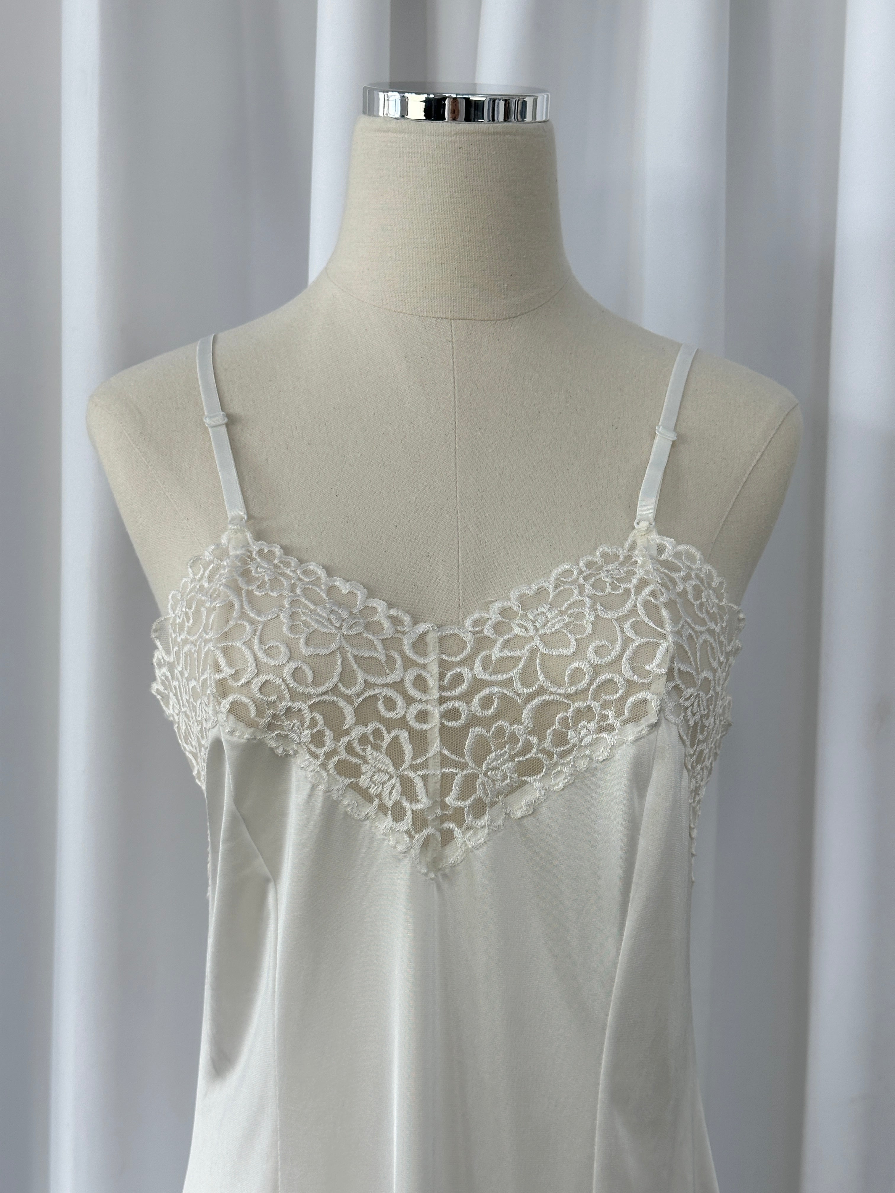 Japanese vintage 1990s lace sheer mini slip dress in size S, featuring delicate lace fabric and a classic 90s silhouette.