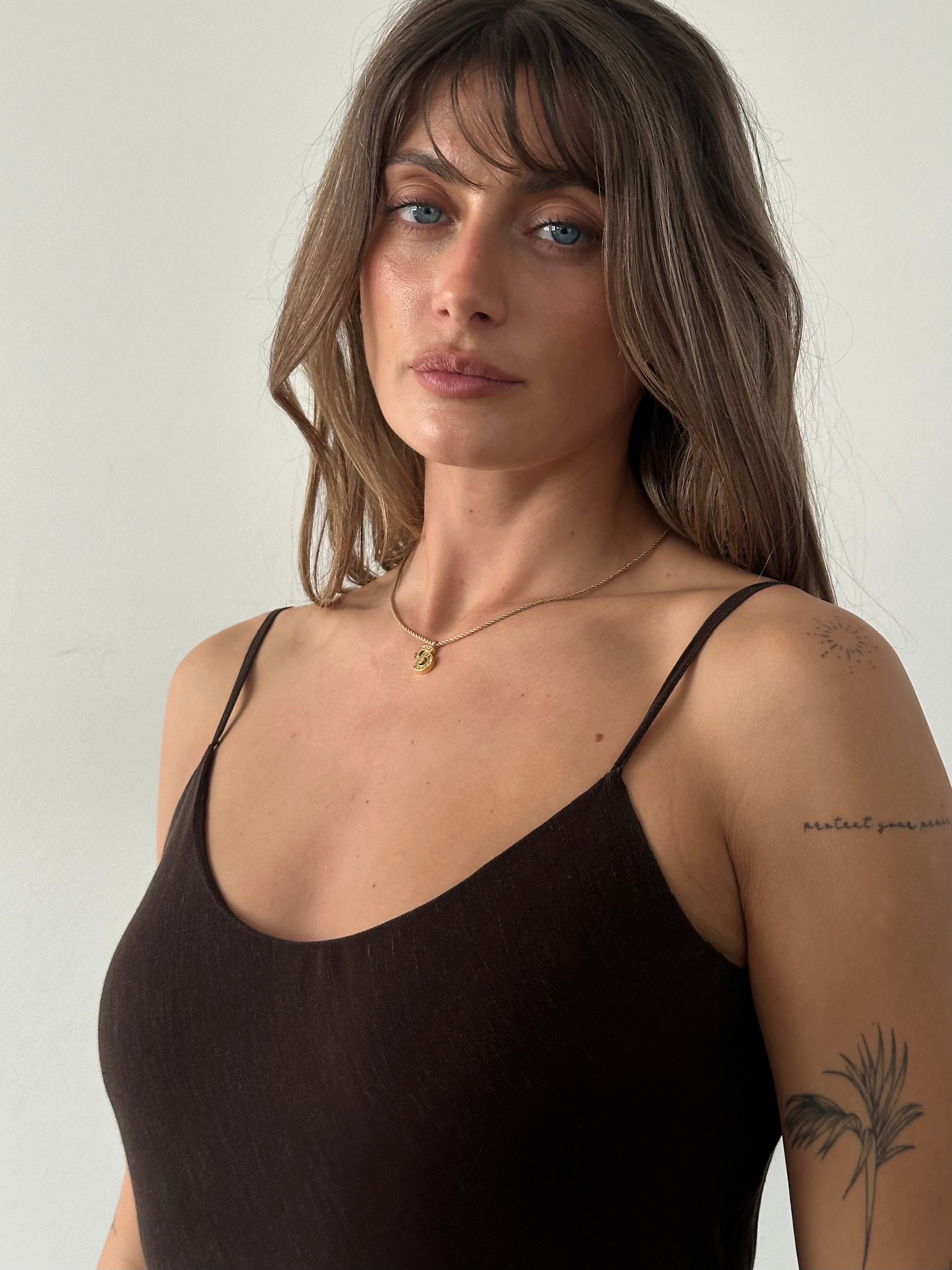 Jigsaw 1990s linen maxi slip dress in S/M with a flowy silhouette and minimalist design, shown hanging against a neutral background.