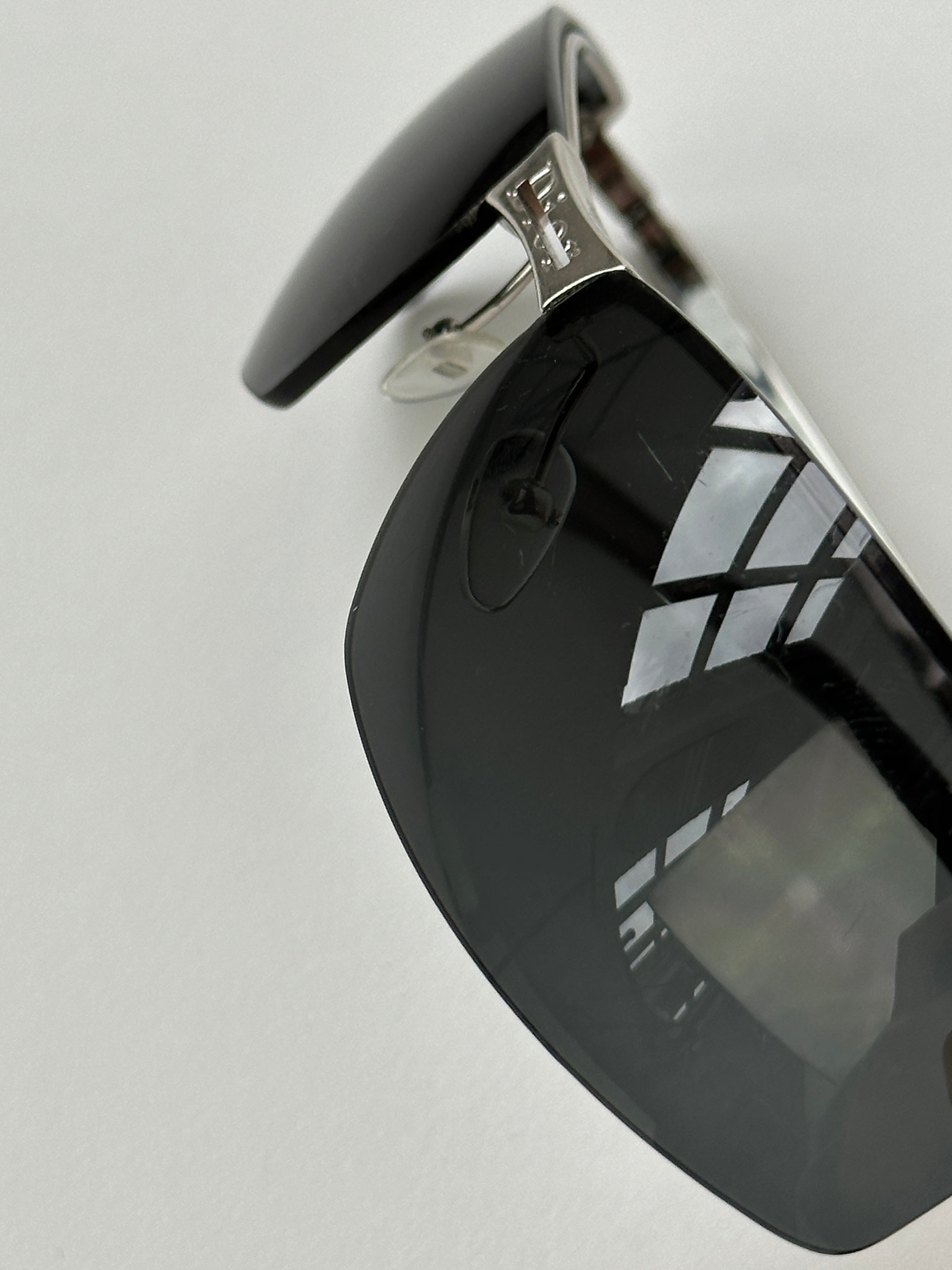 Christian Dior 2000s rimless sunglasses with sleek design and tinted lenses, showcasing elegant eyewear style.