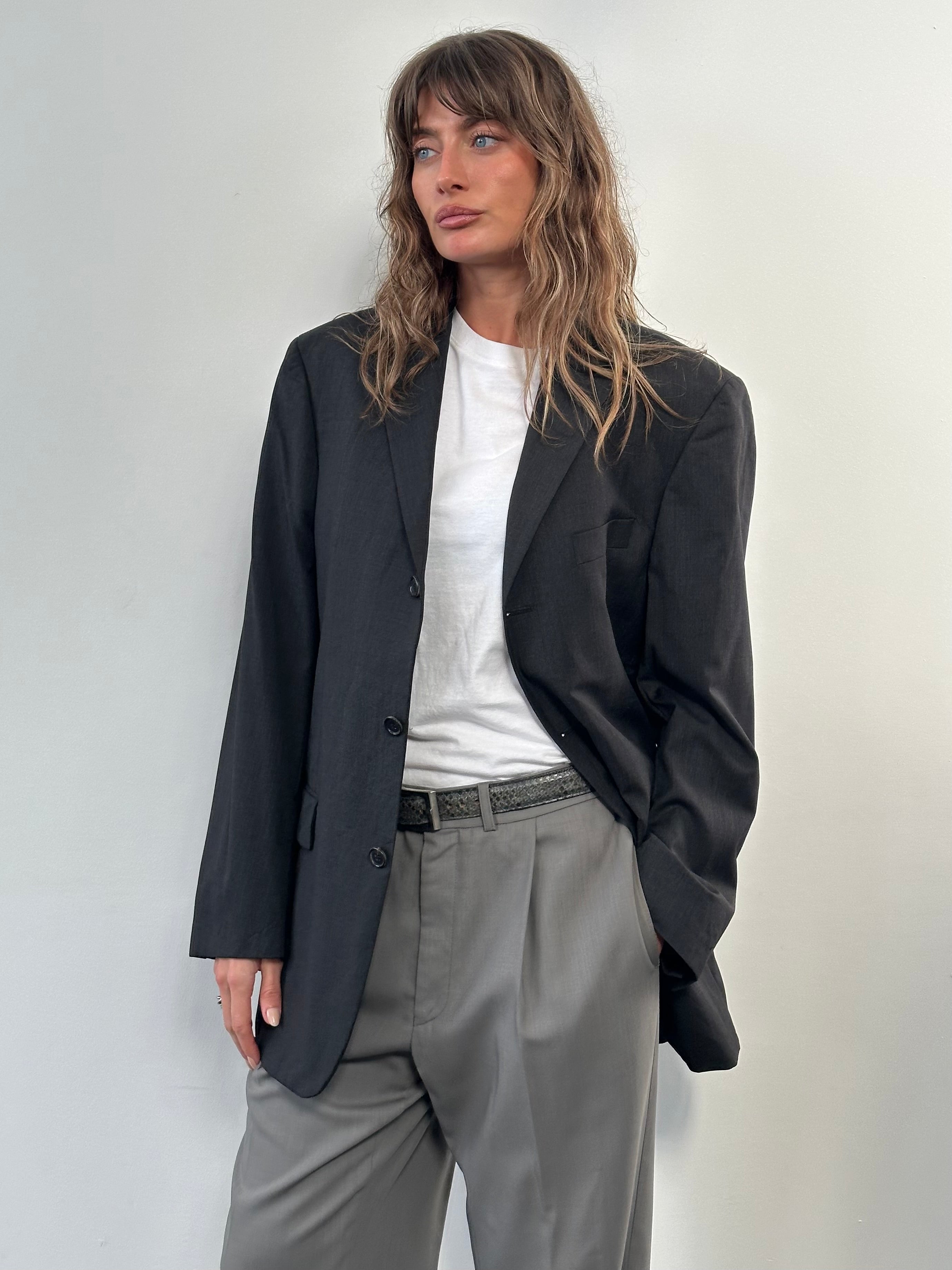 Hugo Boss x Loro Piana 2000s pure wool single-breasted blazer in size 40R/L, shown on a hanger with a classic tailored fit.