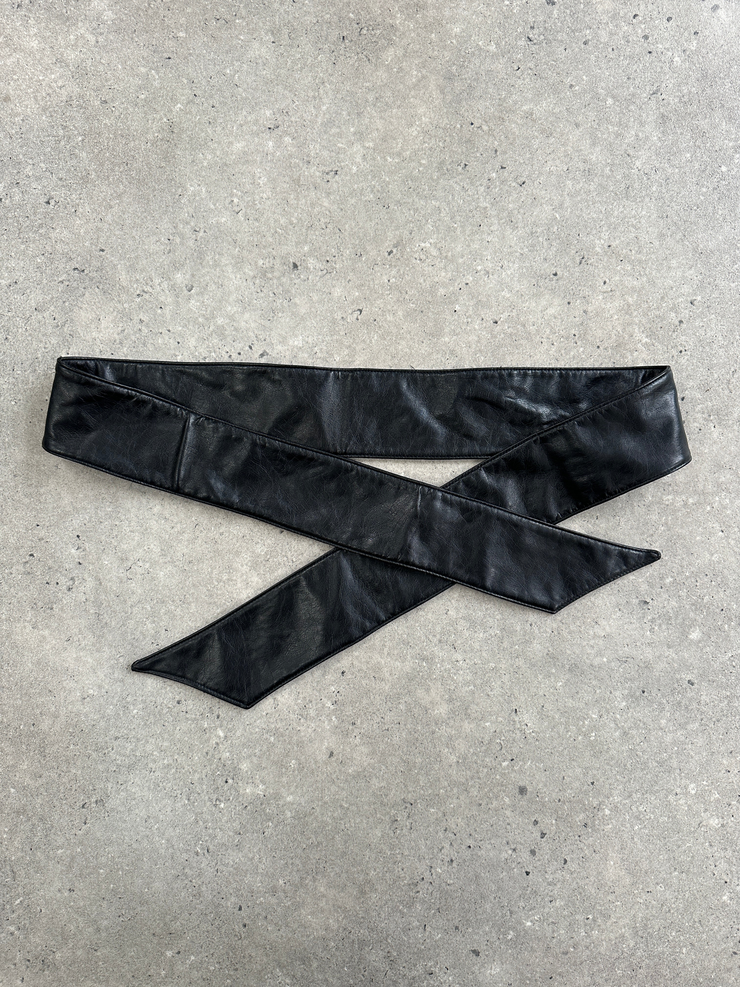 Vintage 1990s faux leather tie belt, one size, showcasing its textured material and classic buckle design.