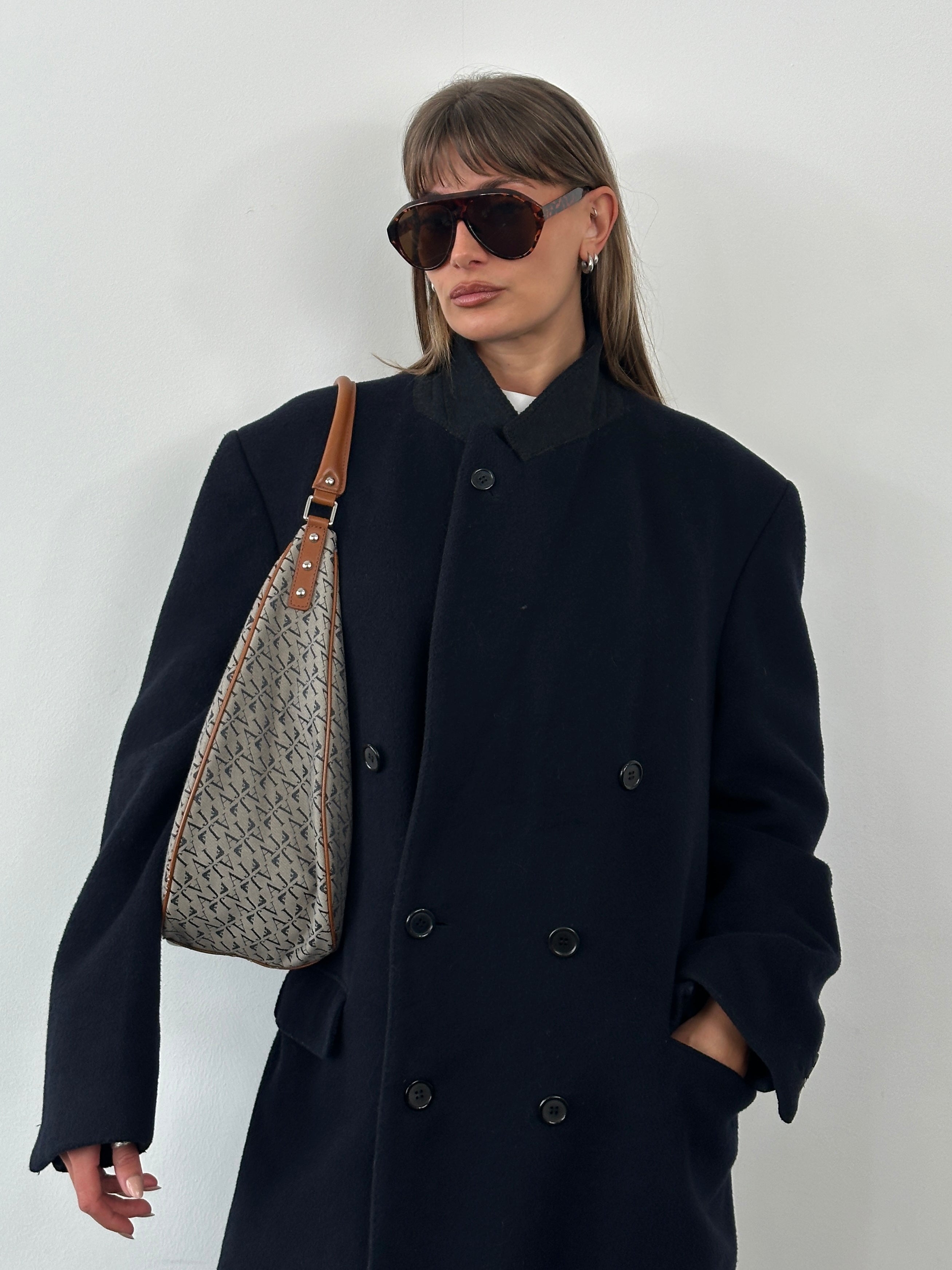 Vintage 1990s wool cashmere double-breasted coat in XL size, showing classic style and textured fabric detail.