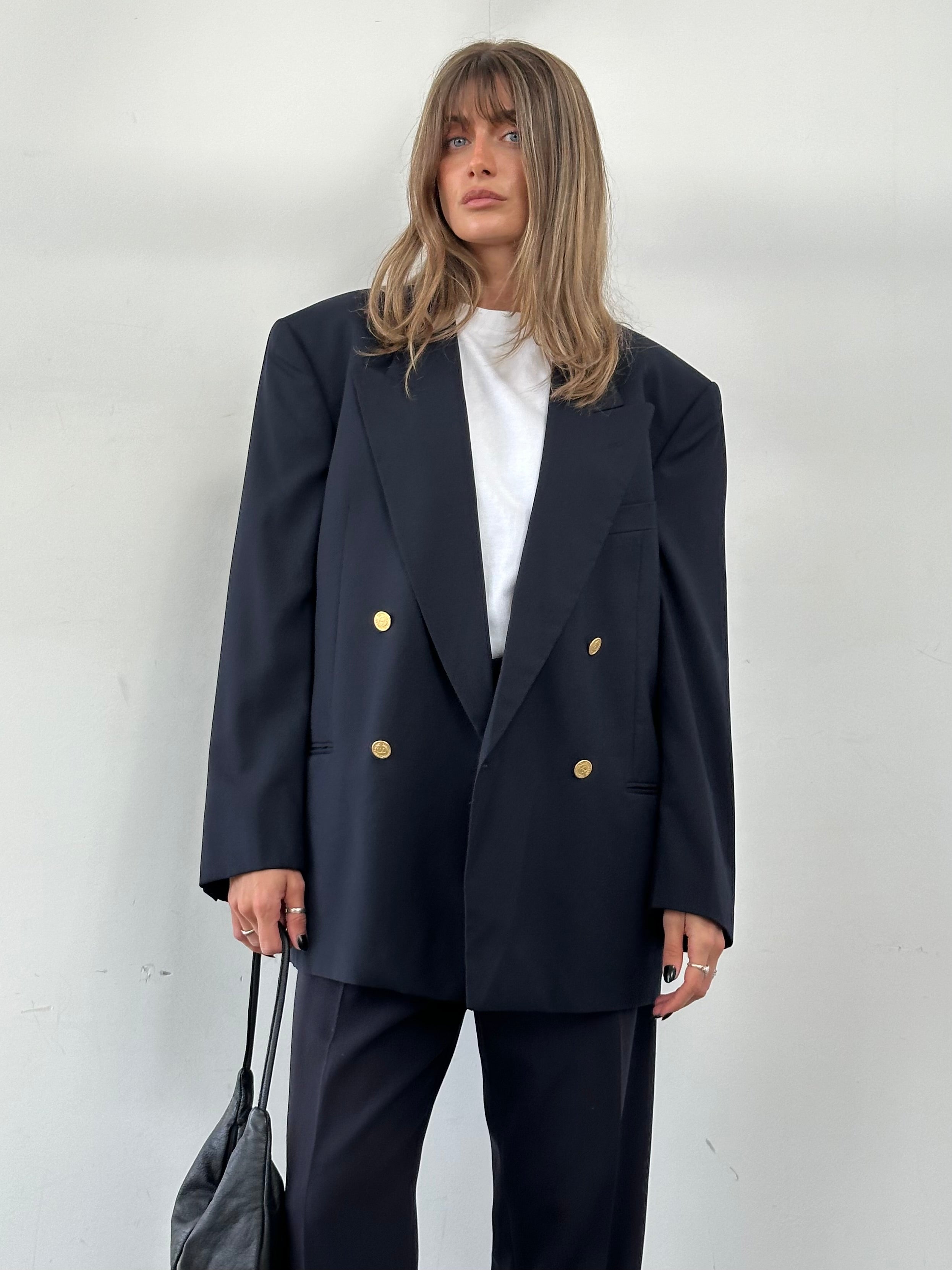 Valentino pure wool double-breasted blazer in size 42R/XL, tailored fit with classic lapels and button details.