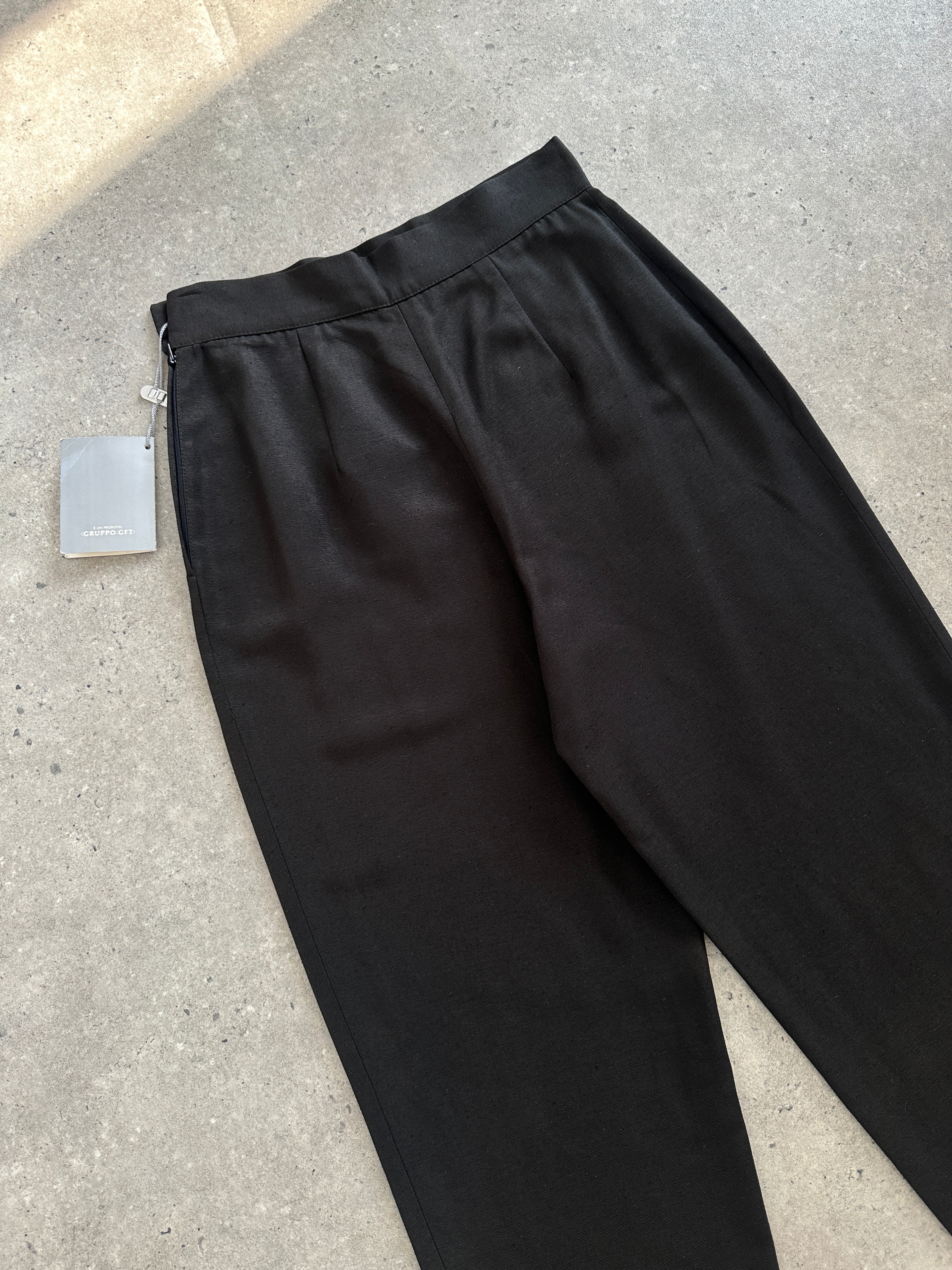 Christian Dior 1990s silk tapered leg trousers with W24 waist, showing the elegant fabric and classic tailored fit.