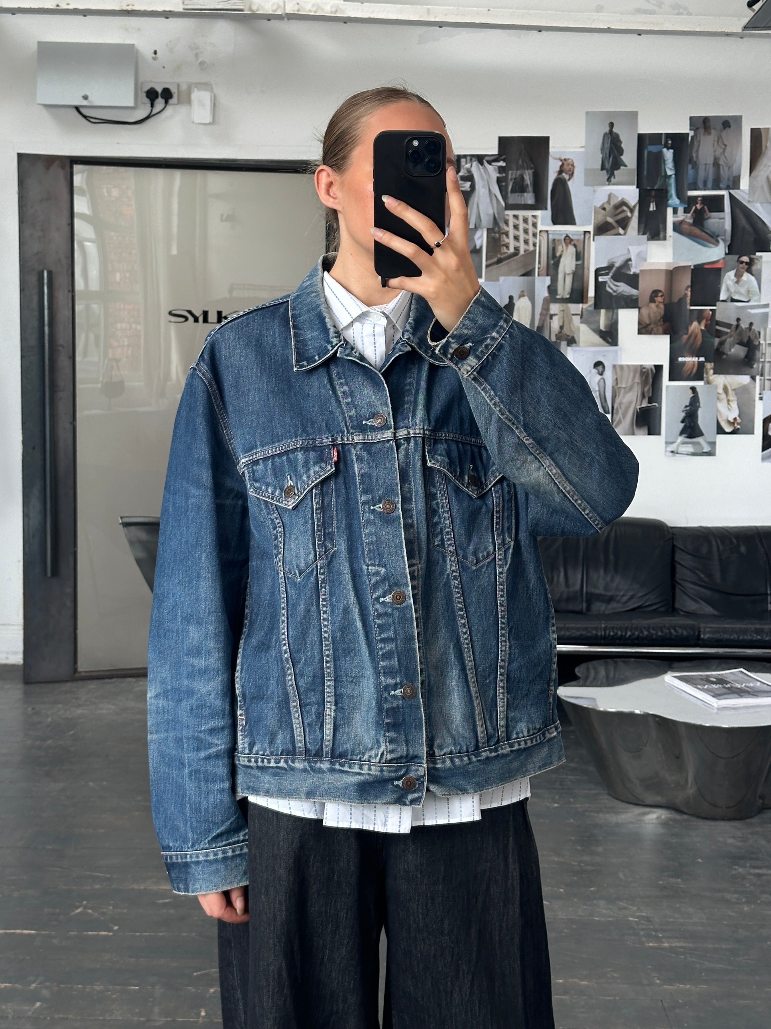 Levi’s 1990s mid wash denim jacket in size XL, displayed on a hanger with a classic casual style and vintage-inspired look.