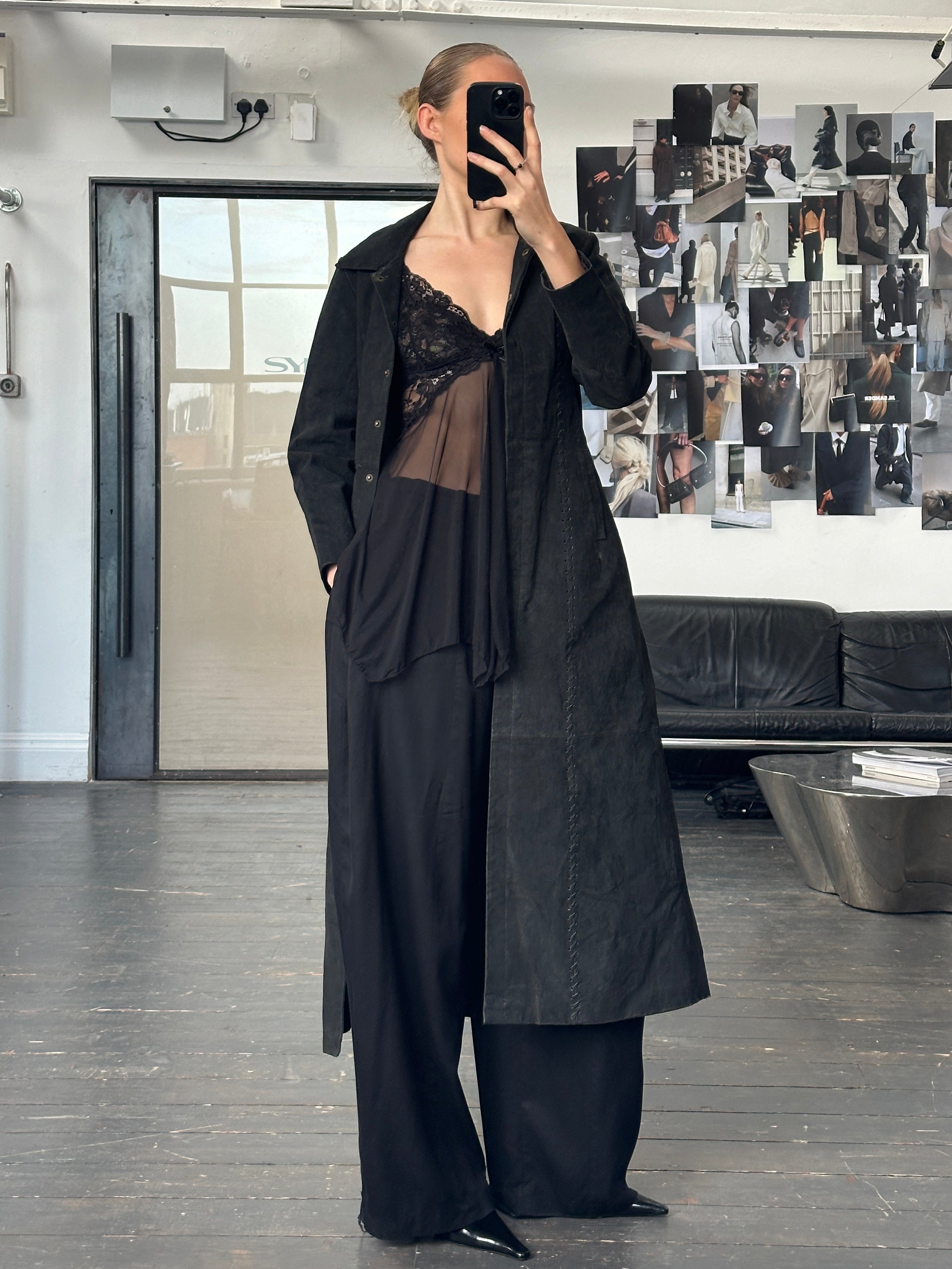 Vintage 1990s sheer lace mesh babydoll top in black, featuring delicate lace details and a flowy, lightweight design.