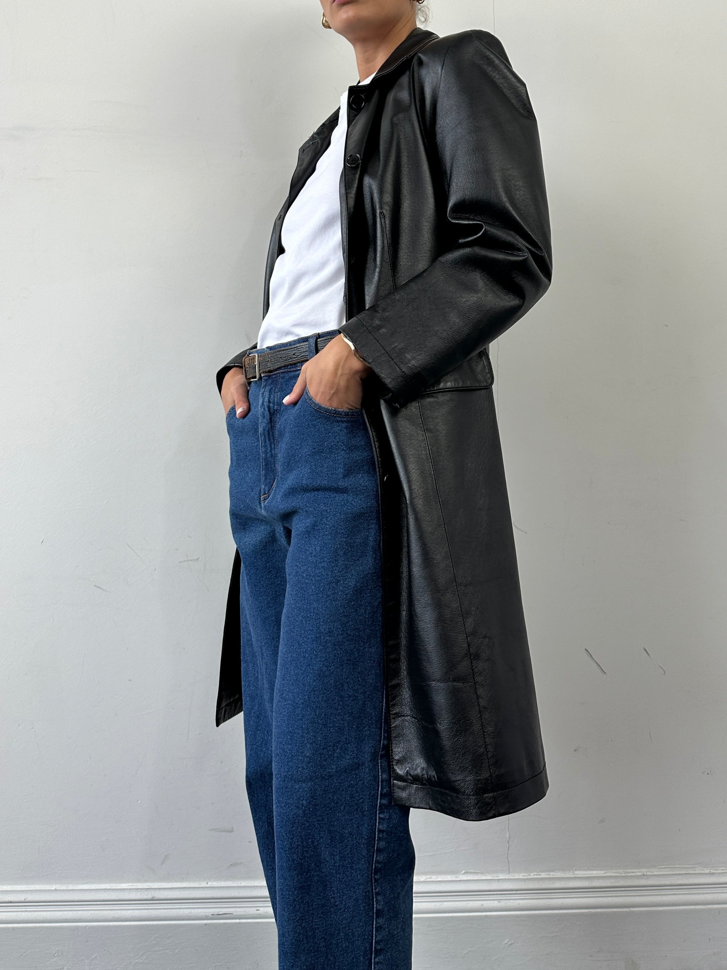 Italian vintage leather trench coat, single-breasted design, in size small, showcasing classic style and rich brown leather.