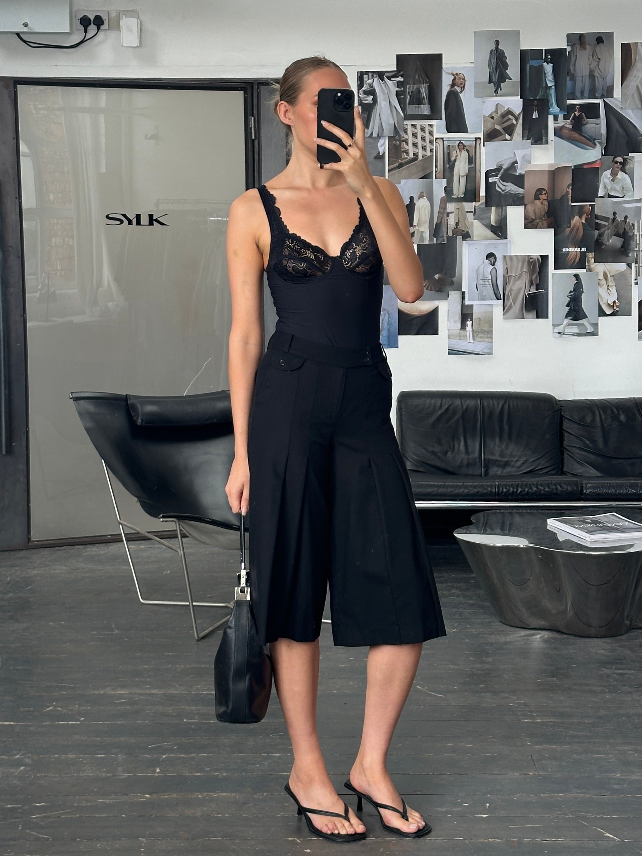Vintage 1990s wool pleated culottes shorts in a classic design, featuring a high waist and wide-leg fit, shown in the image.
