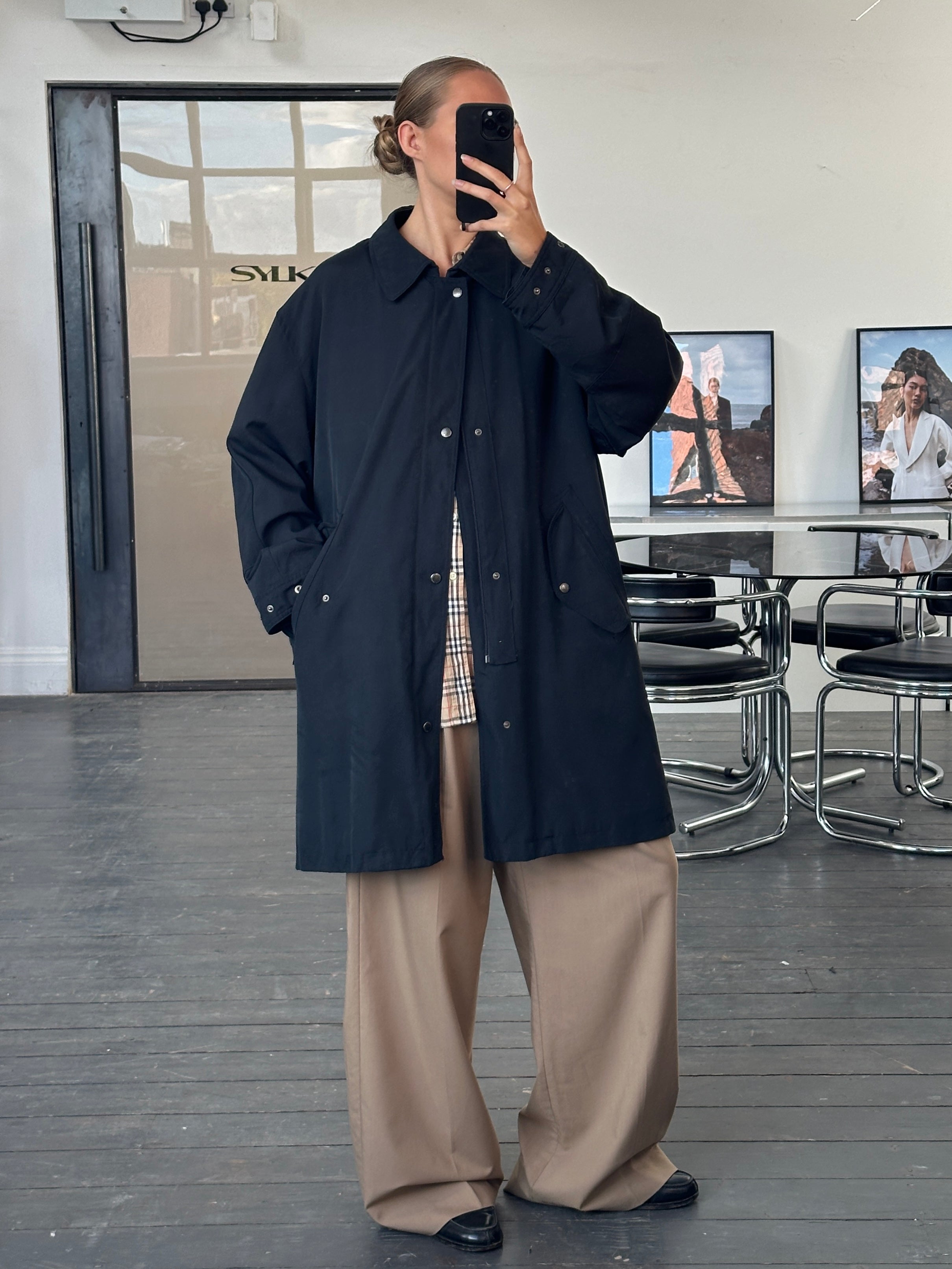 Burberry London 1990s waterproof Nova Check trench coat in XL/XXL, showing classic beige and black check pattern and belted design.
