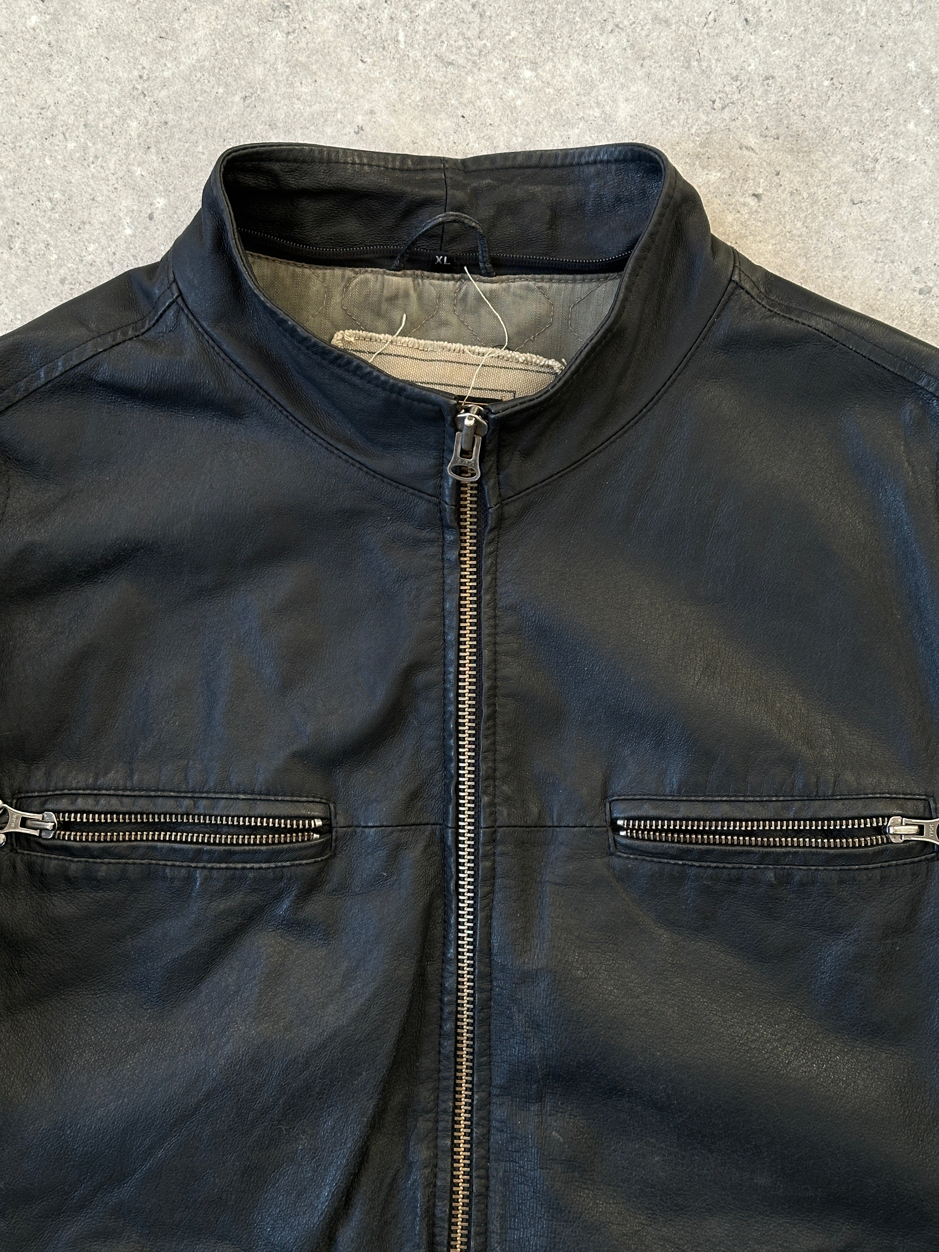 Vintage brand vintage zip-up leather jacket, size large, featuring classic design with a front zipper and stylish leather material.