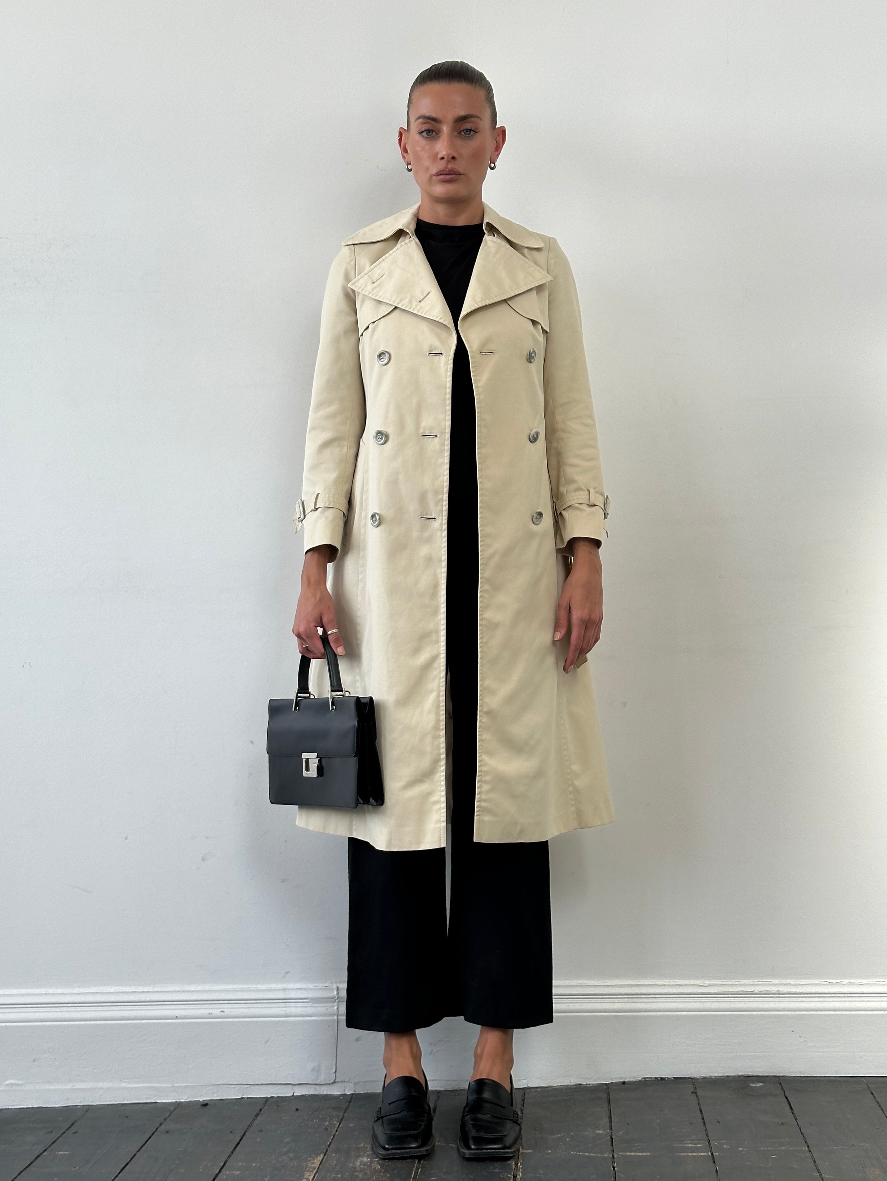 Vintage 1980s cotton double-breasted belted trench coat, XS size, classic style with a timeless design and traditional collar.