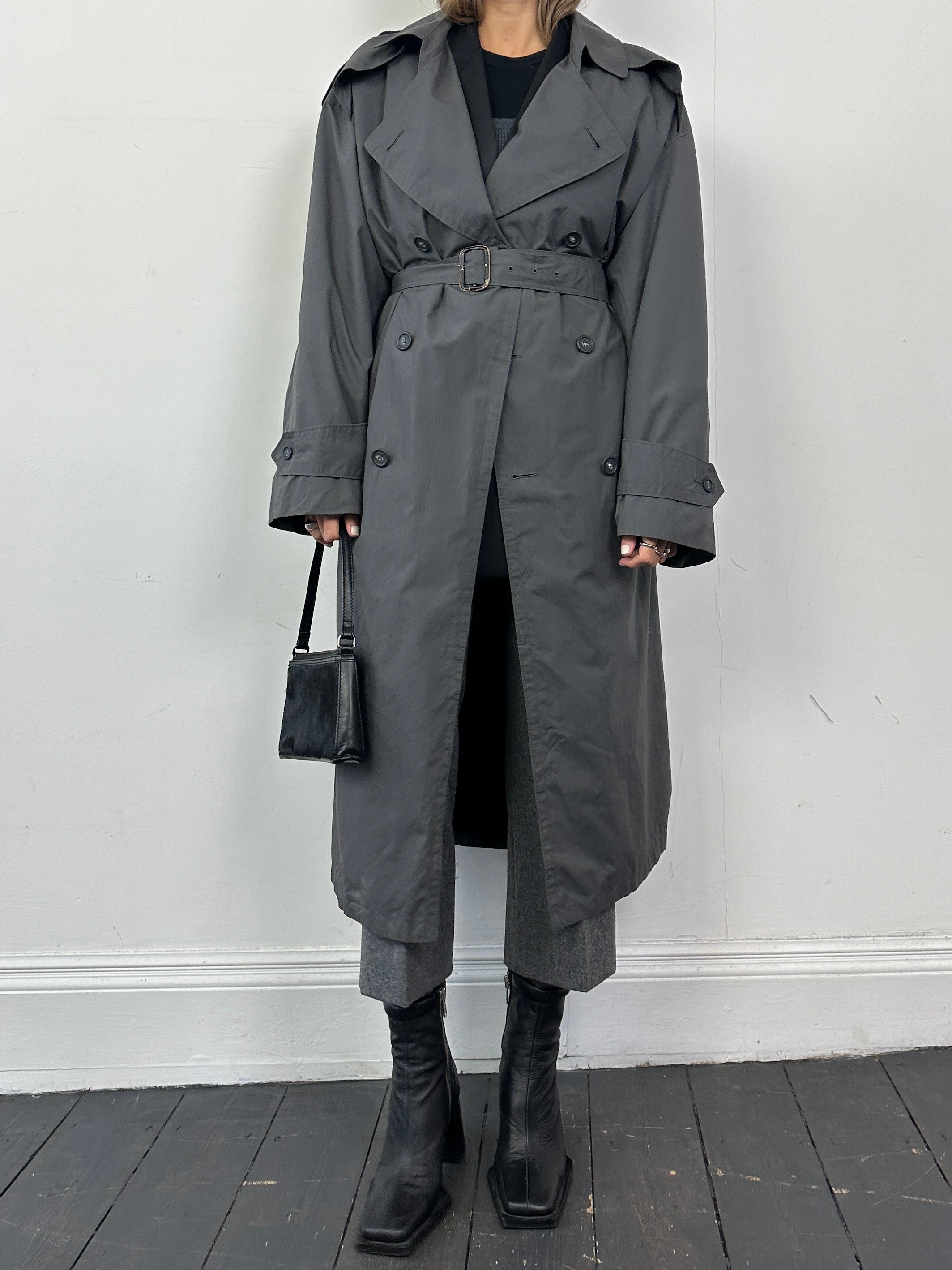 Christian Dior Monsieur cotton double-breasted belted trench coat in XL, shown hanging with classic trench design and neutral color.