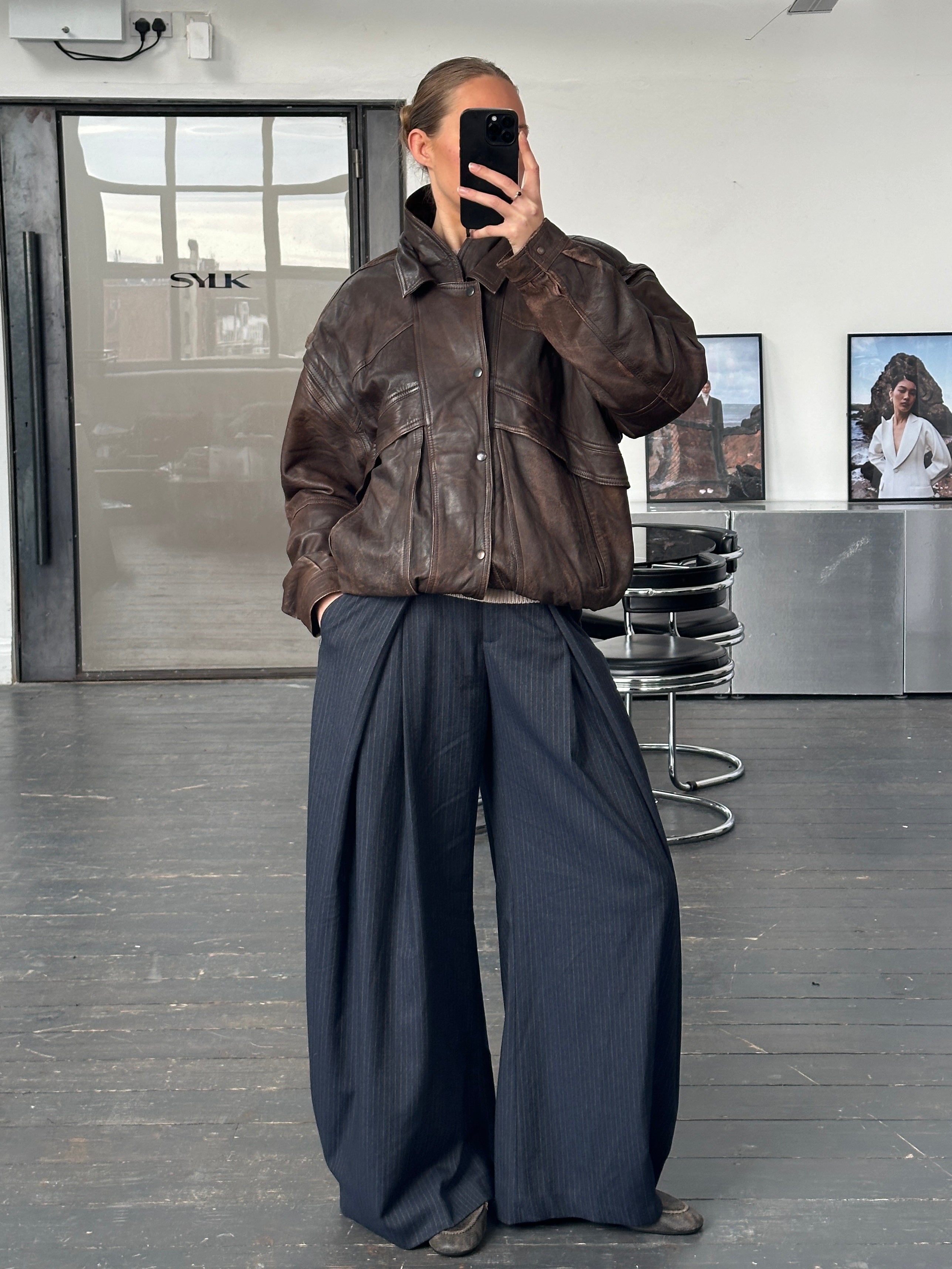 Vintage 1990s aged double collar leather bomber jacket in XL size, featuring distressed brown leather and classic military style.