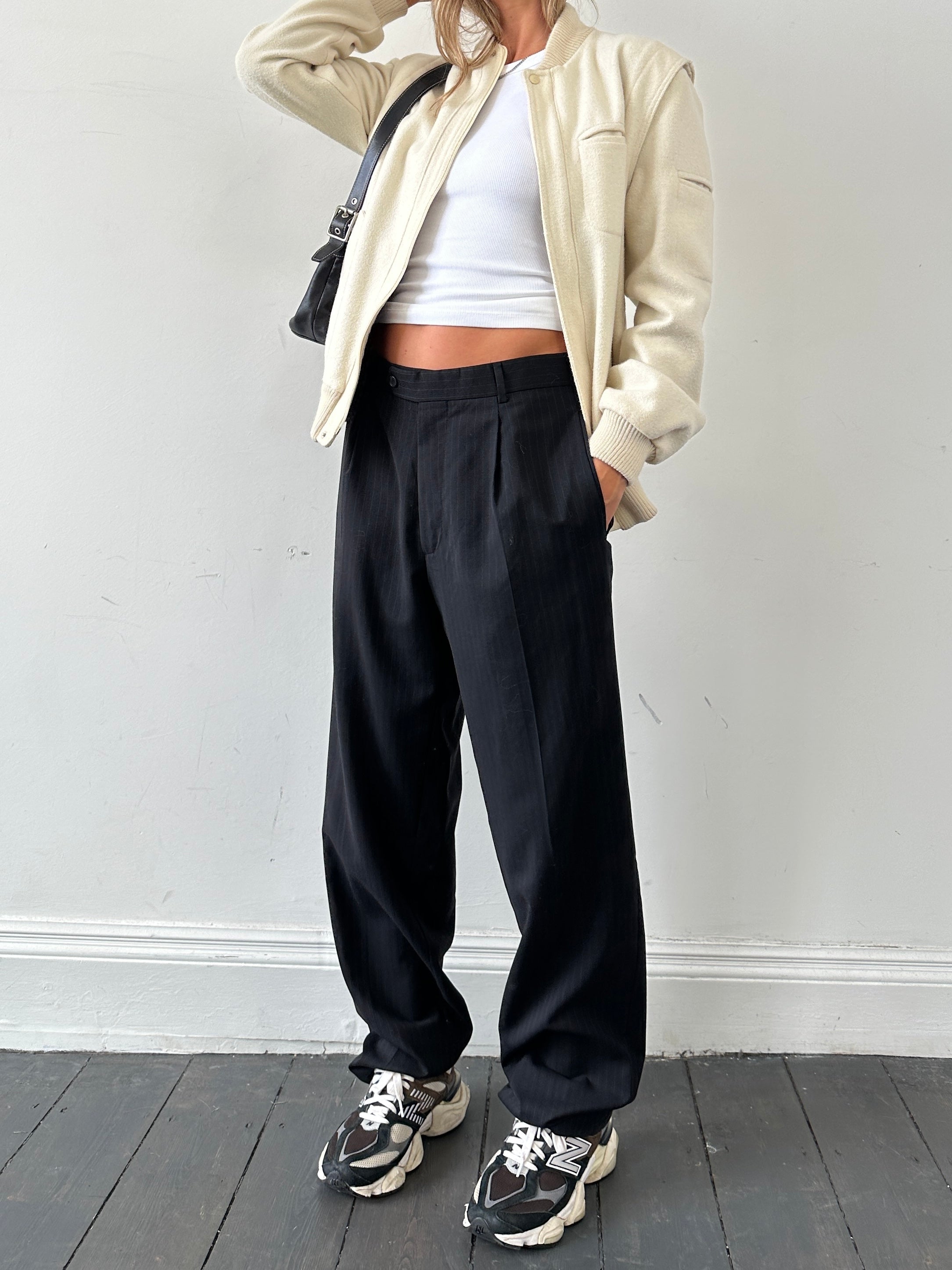 Vintage pinstripe virgin wool tailored trousers with pleats, high waist, and a classic tall fit in size W32.