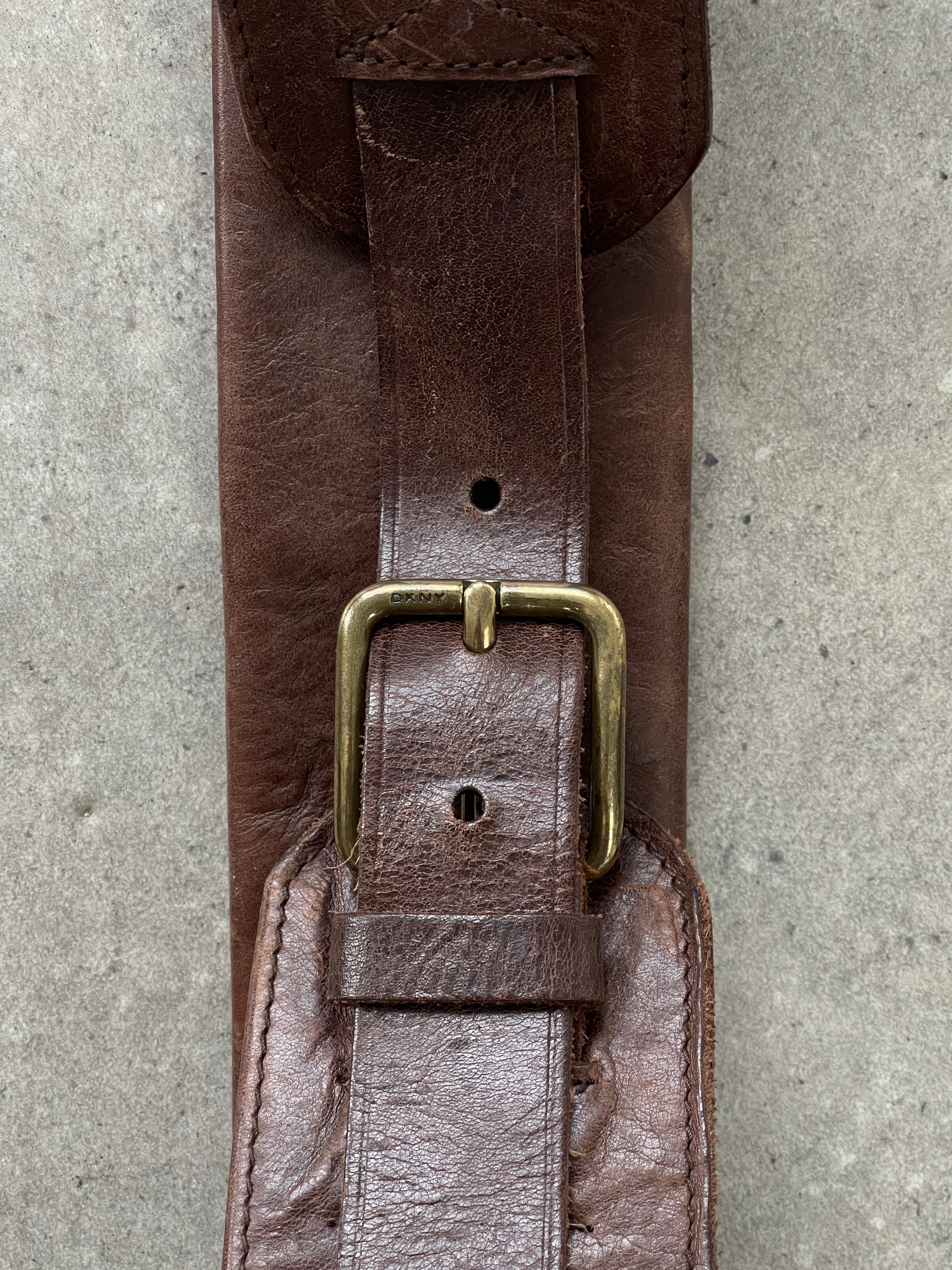 DKNY leather chunky utility belt bag with adjustable W31-33 size, featuring multiple compartments and a modern, stylish design.
