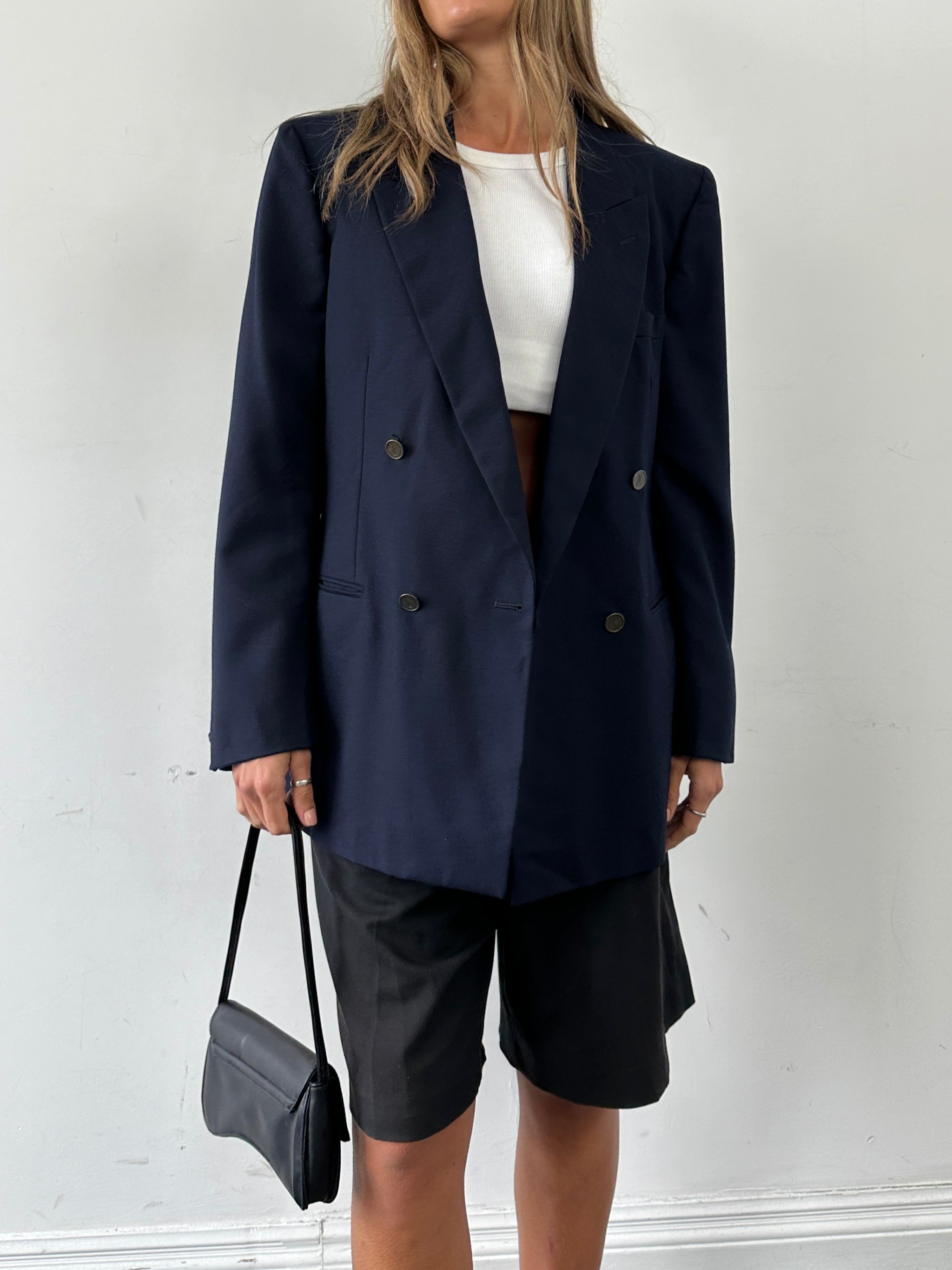 Yves Saint Laurent double-breasted pure wool blazer in size 42R/L-XL, featuring classic lapels and tailored fit.