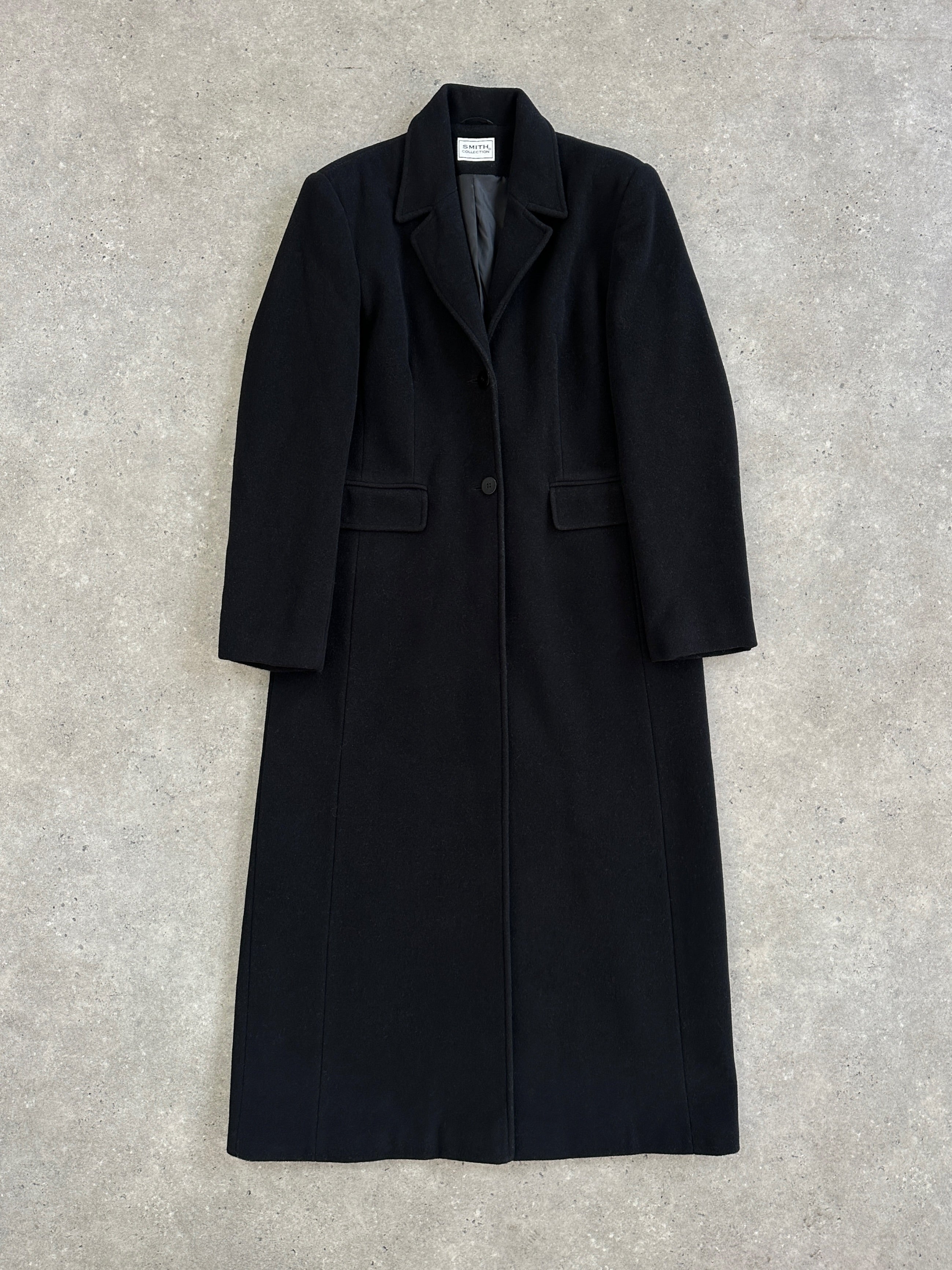 Vintage 1990s wool floor-length coat in black, available in size S/M, featuring classic vintage style and warm fabric.