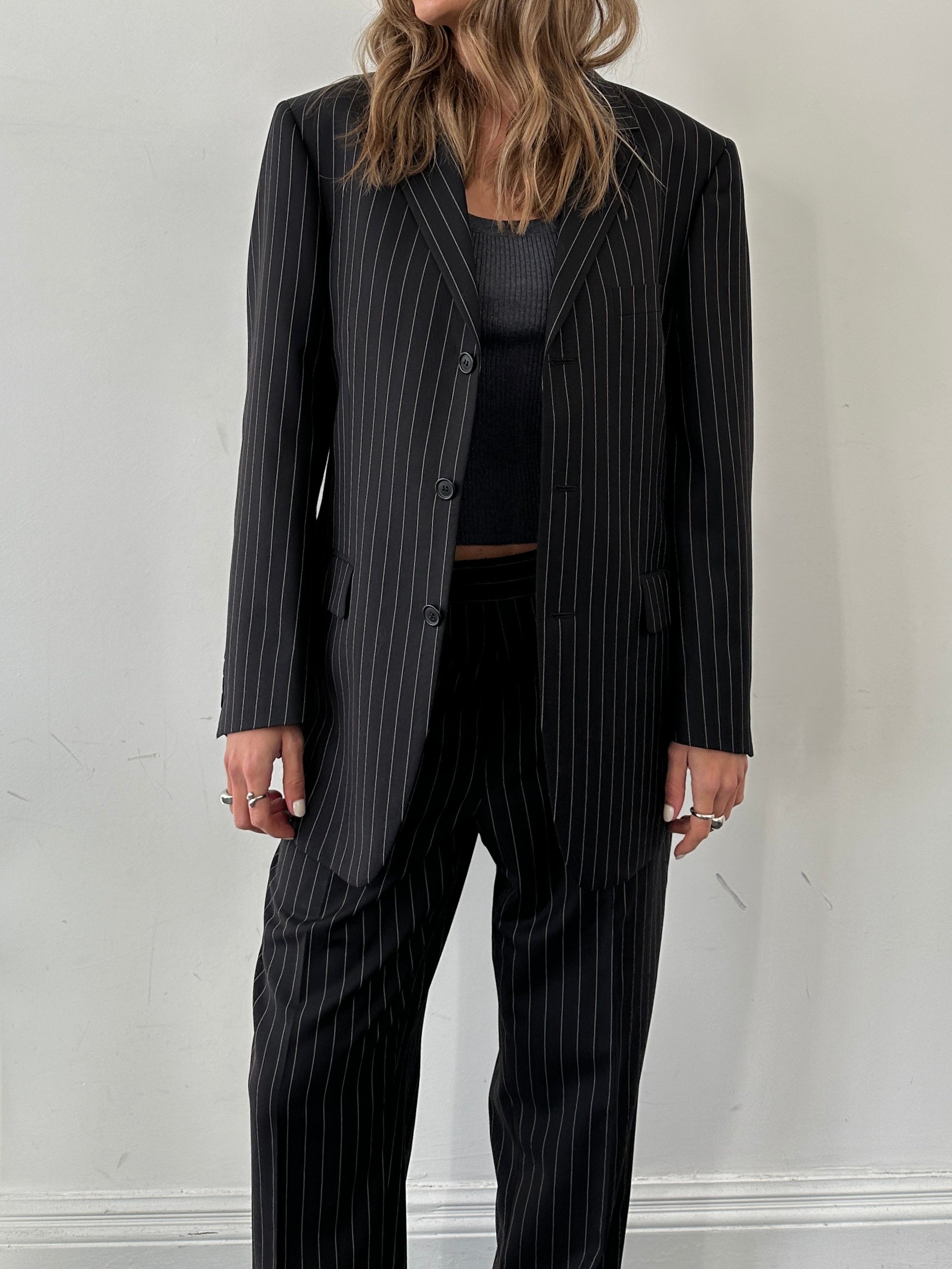 Yves Saint Laurent pinstripe wool jumpsuit in size 40S/W34, tailored fit with classic pinstripe pattern and structured design.