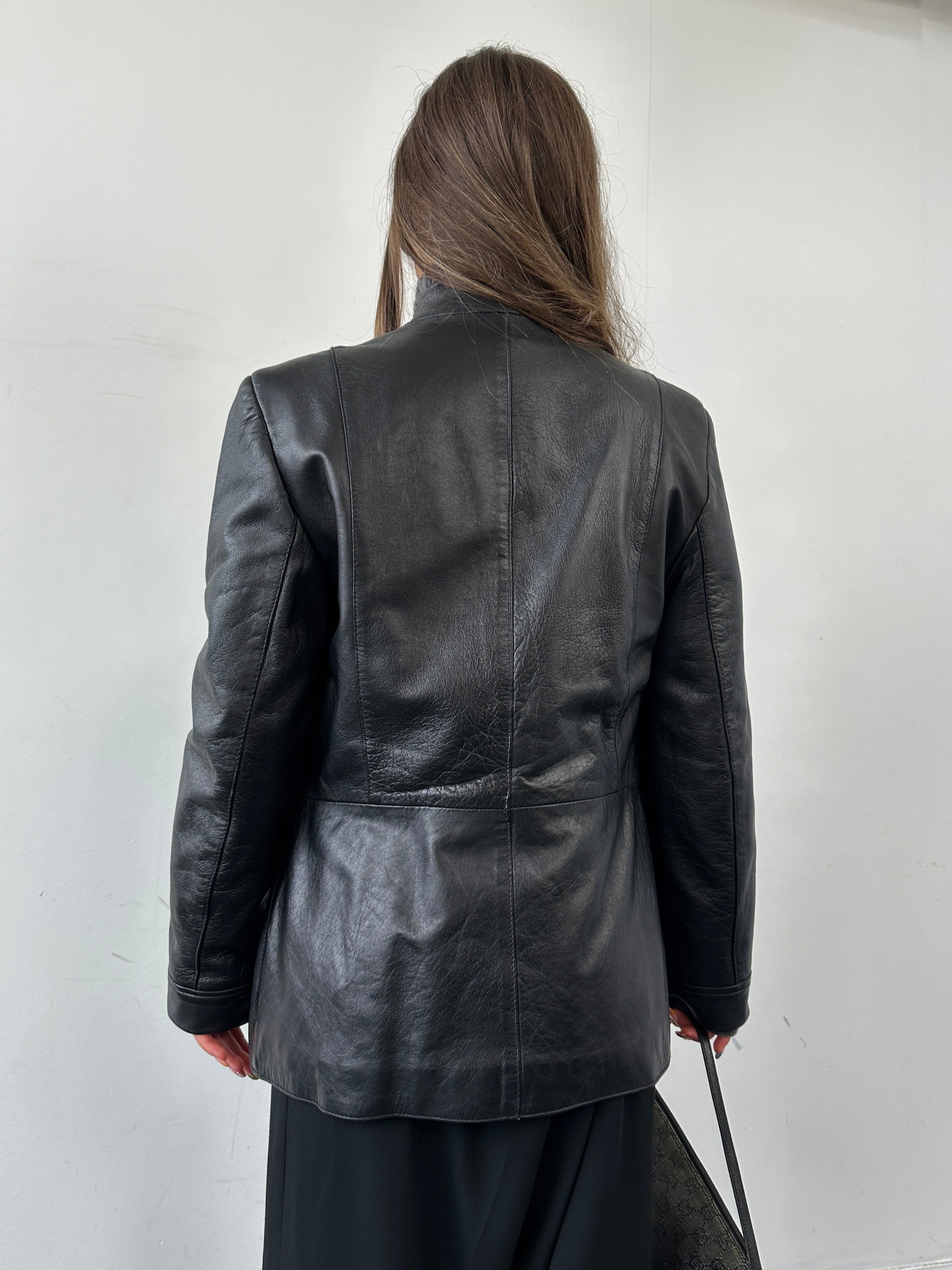 Vintage Italian vintage minimal leather jacket in XS/S, featuring sleek design and classic craftsmanship.