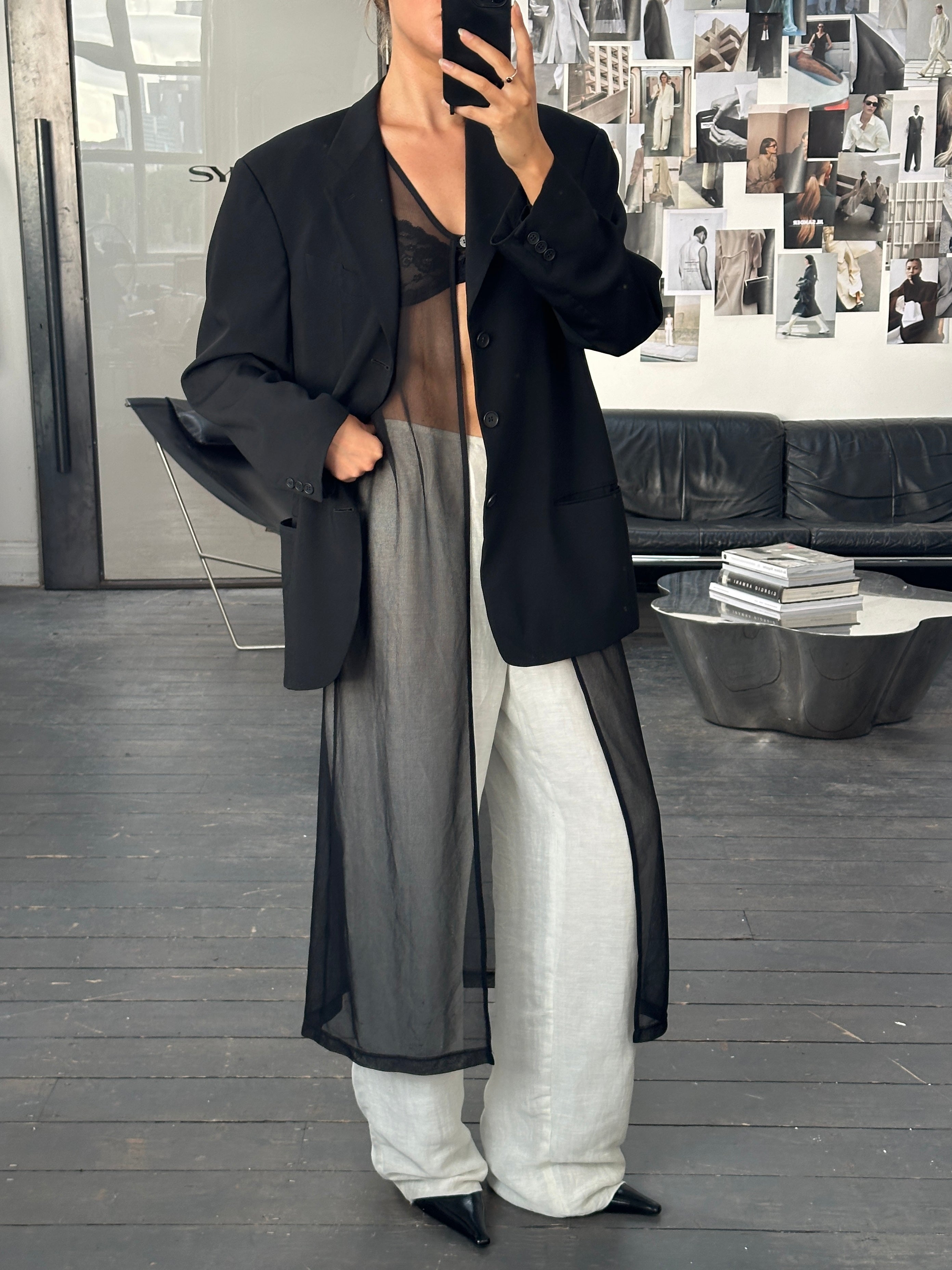Giorgio Armani 1999 wide leg linen trousers in beige, showing the relaxed fit and lightweight fabric, size W28-30.