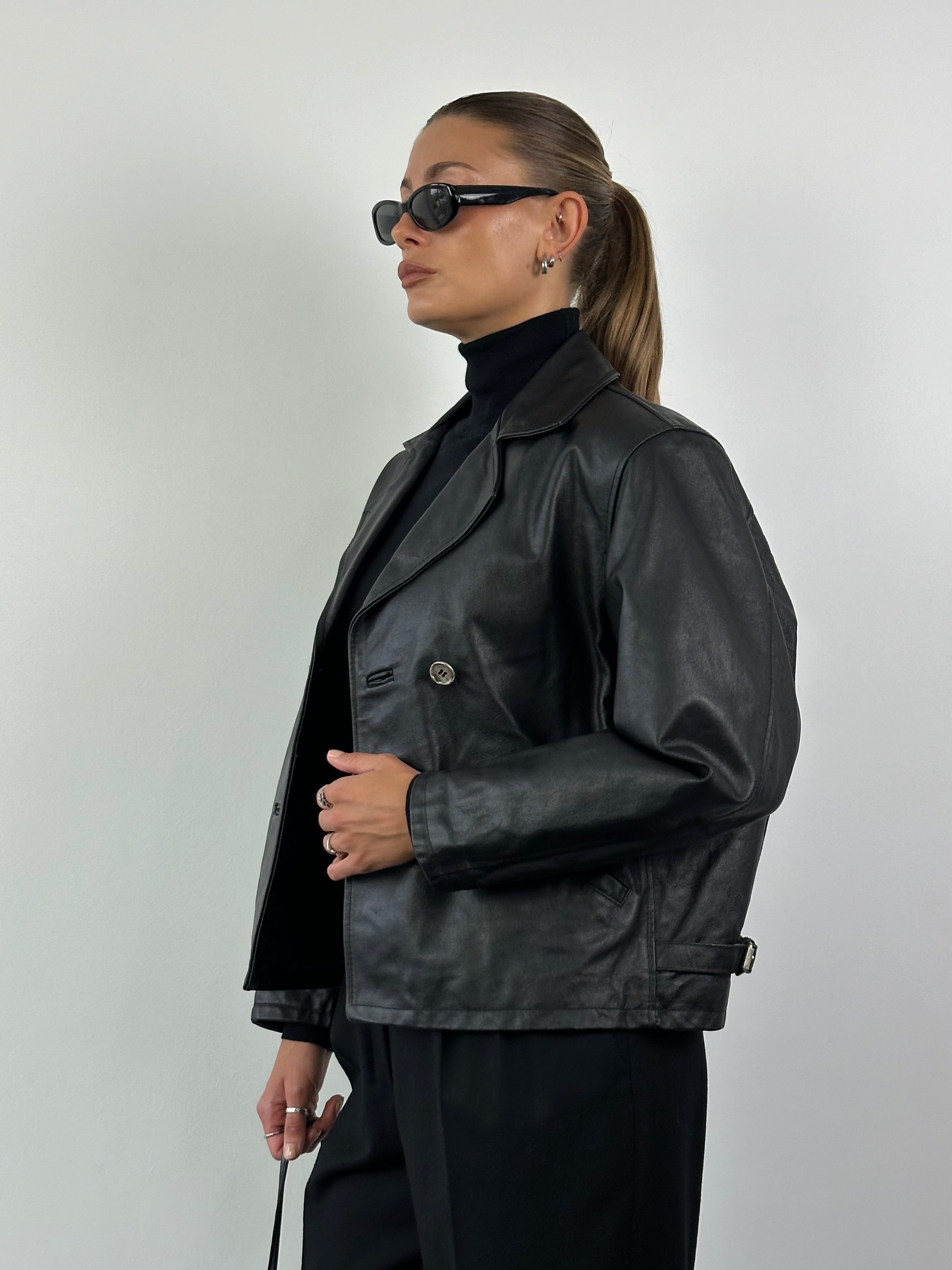 Vintage Italian leather cropped double-breasted jacket, stylish men's fashion piece with classic design and texture.