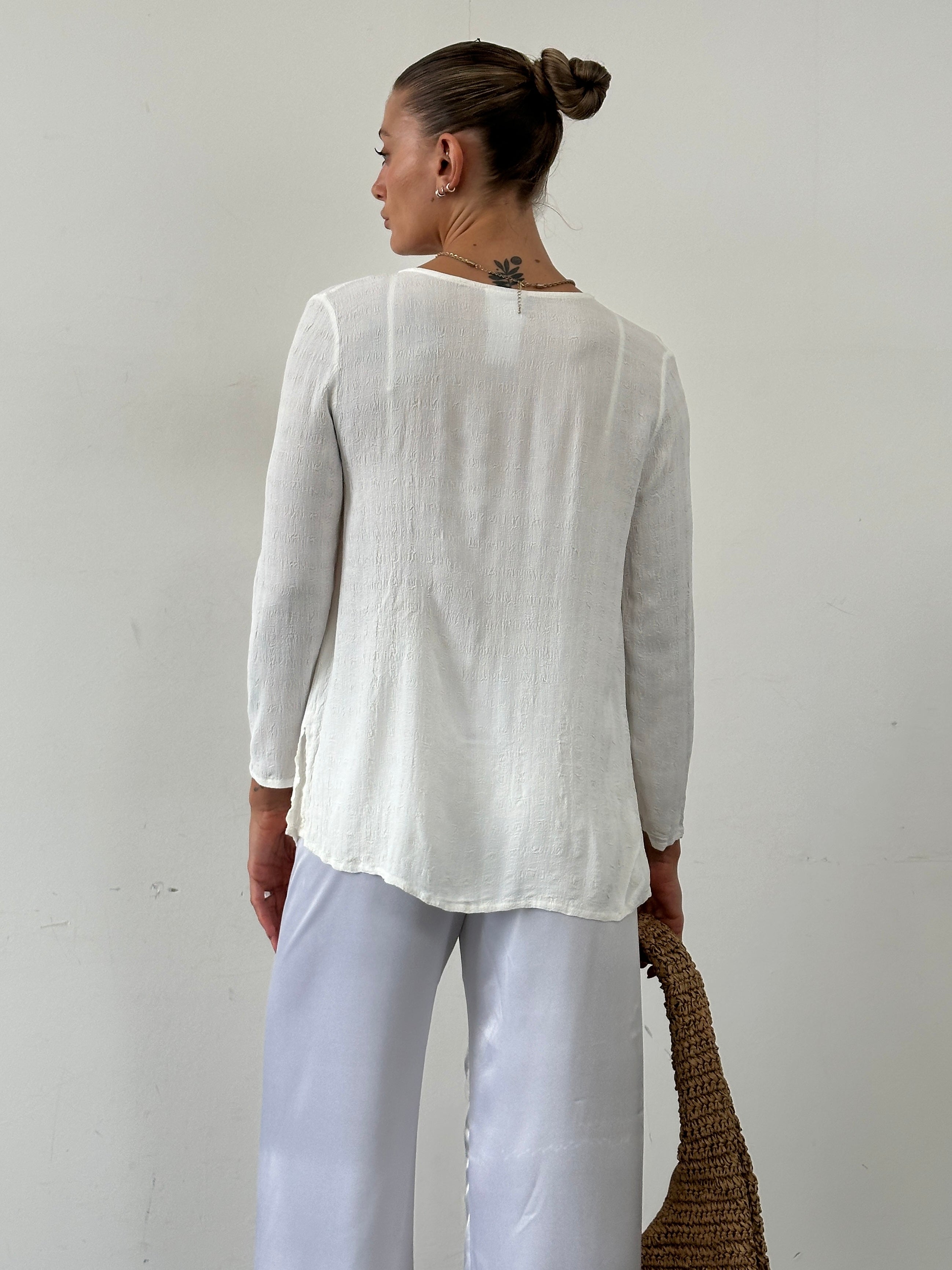 Laura Ashley textured collarless shirt in size M displayed on a hanger, featuring a soft fabric and stylish design.