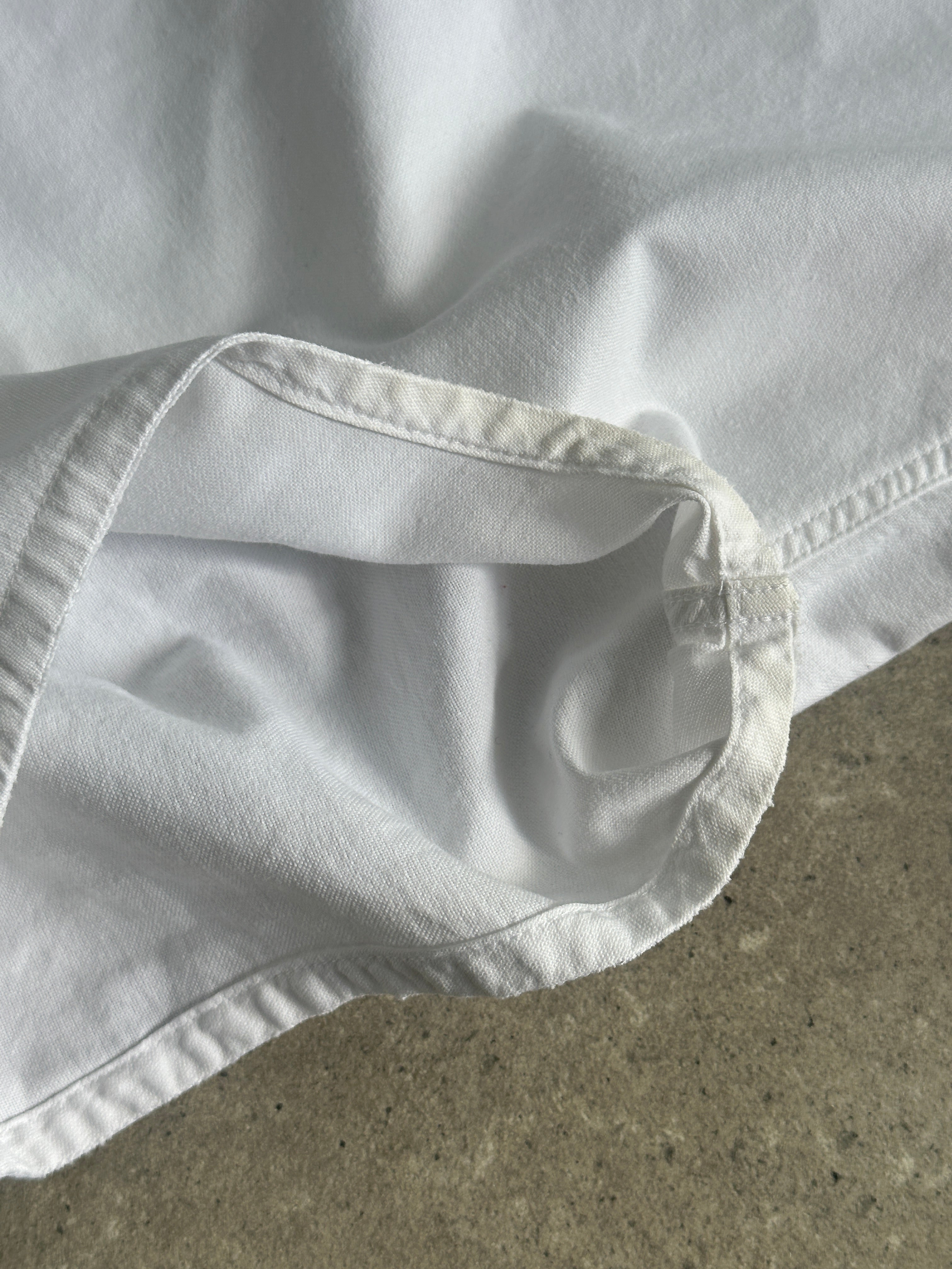 Burberry London pure cotton sleeveless shirt in size S, light-colored fabric with classic collar and button details.