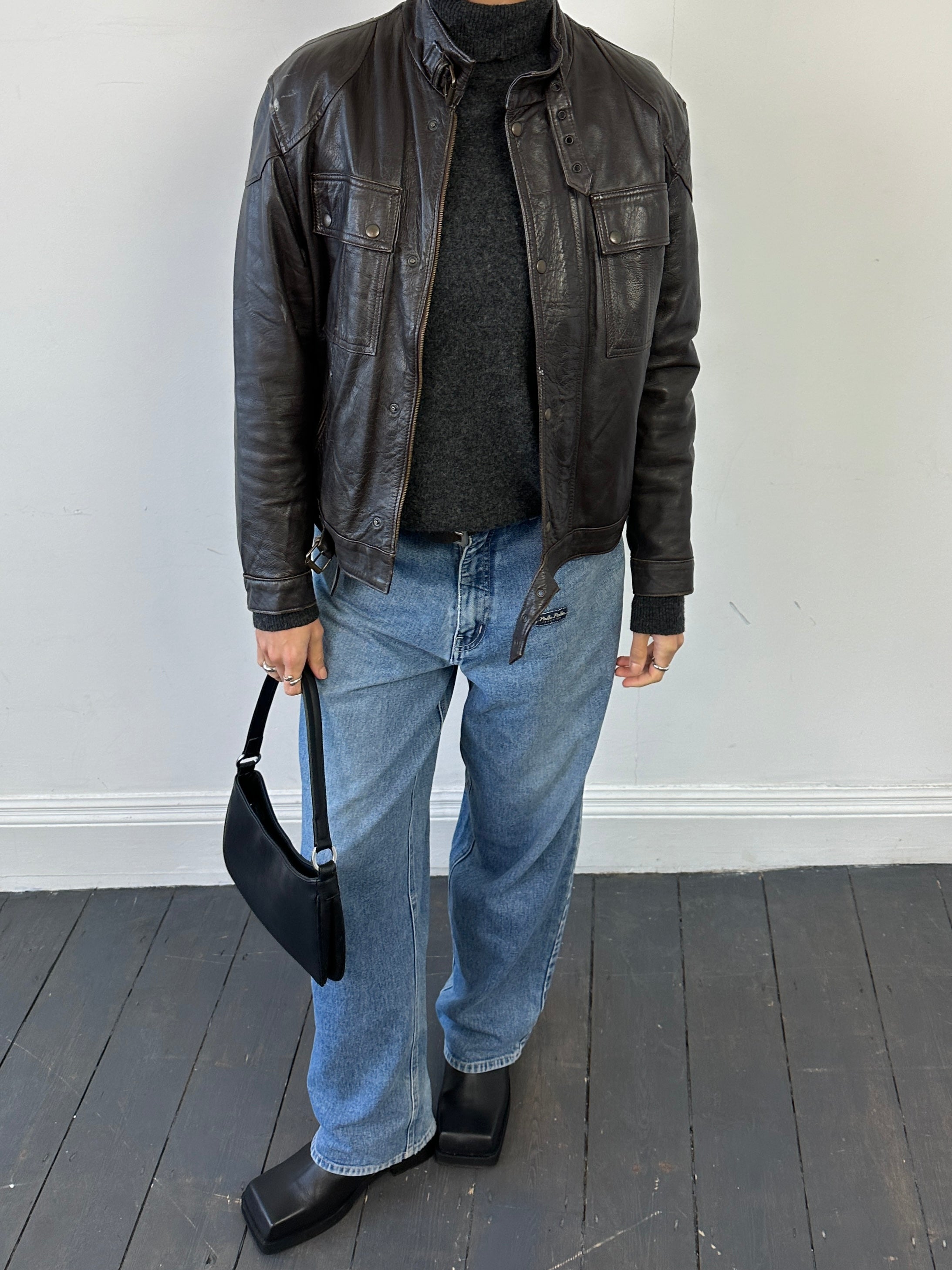 Vintage Italian vintage Moto leather jacket in size S, featuring classic biker style with distressed leather and metal hardware.