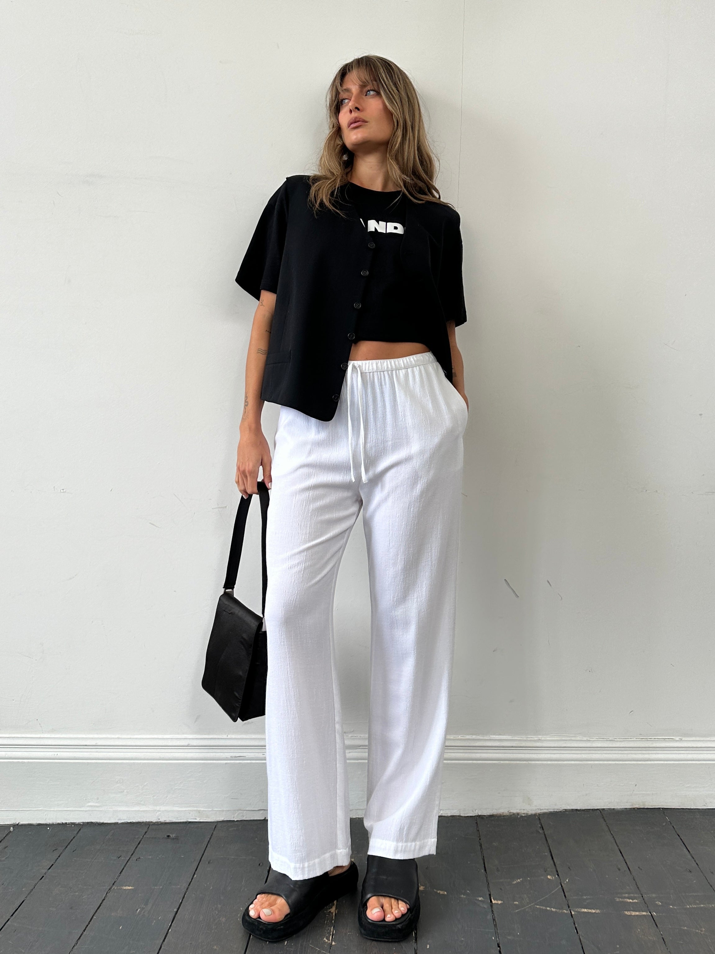Vintage wide leg pull-on trousers with elastic waist and crinkle effect, available in waist sizes W28-32.