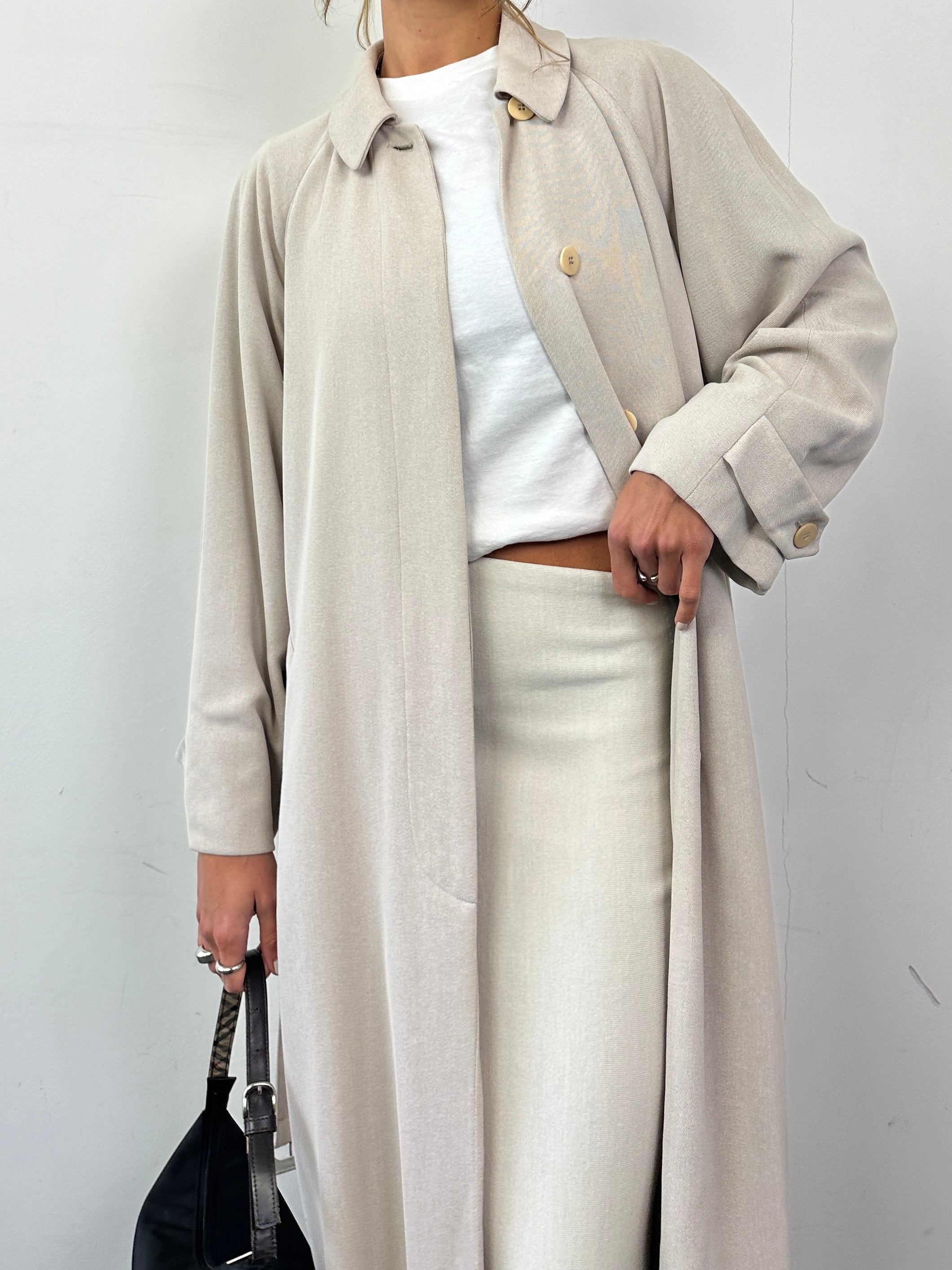 Giorgio Armani Le Collezioni wool floor-length belted coat in navy, featuring a tailored fit and classic collar.