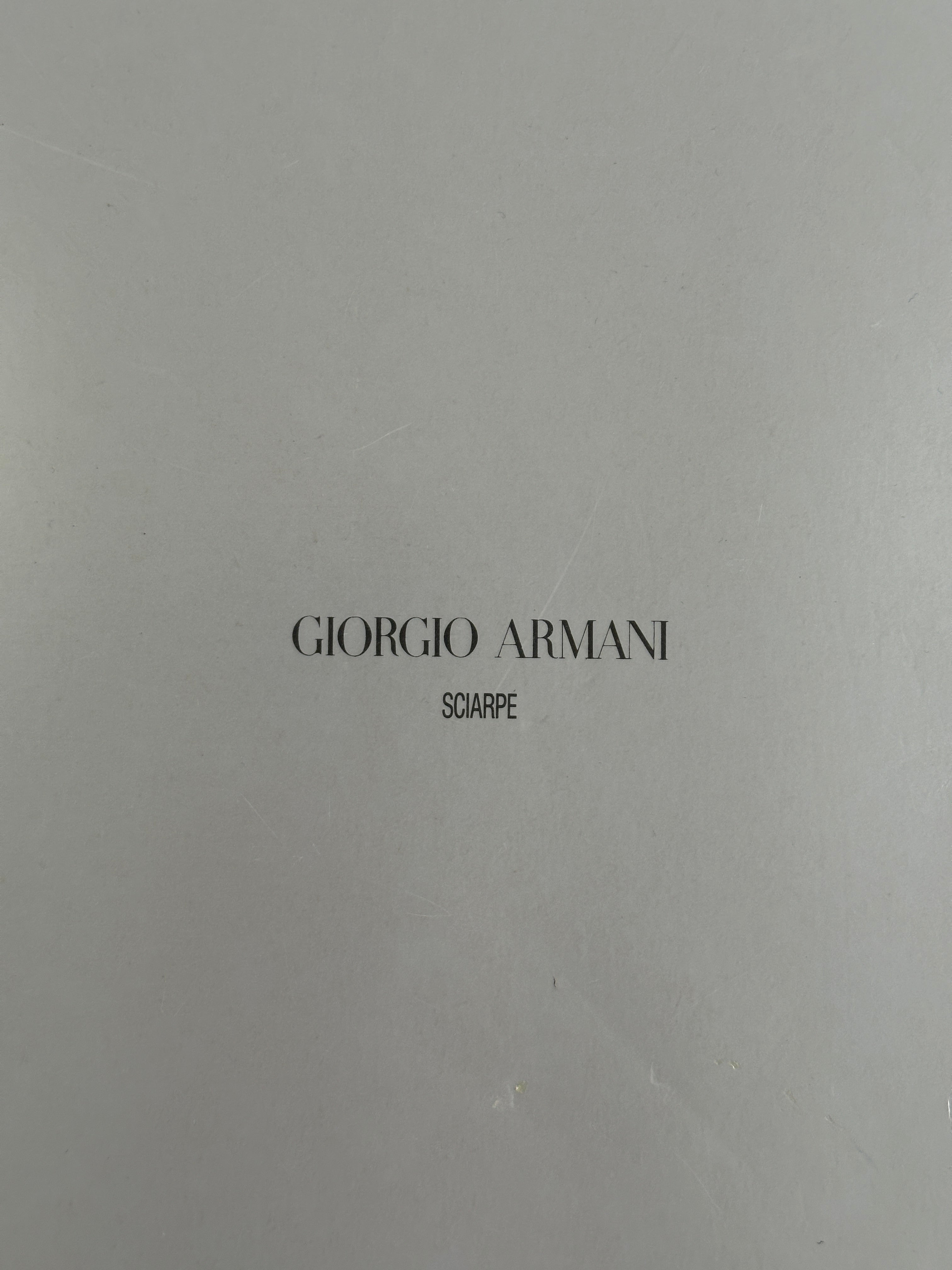 Giorgio Armani Le Collezioni 2000s pure wool logo scarf with classic design and subtle branding, displayed flat for styling.