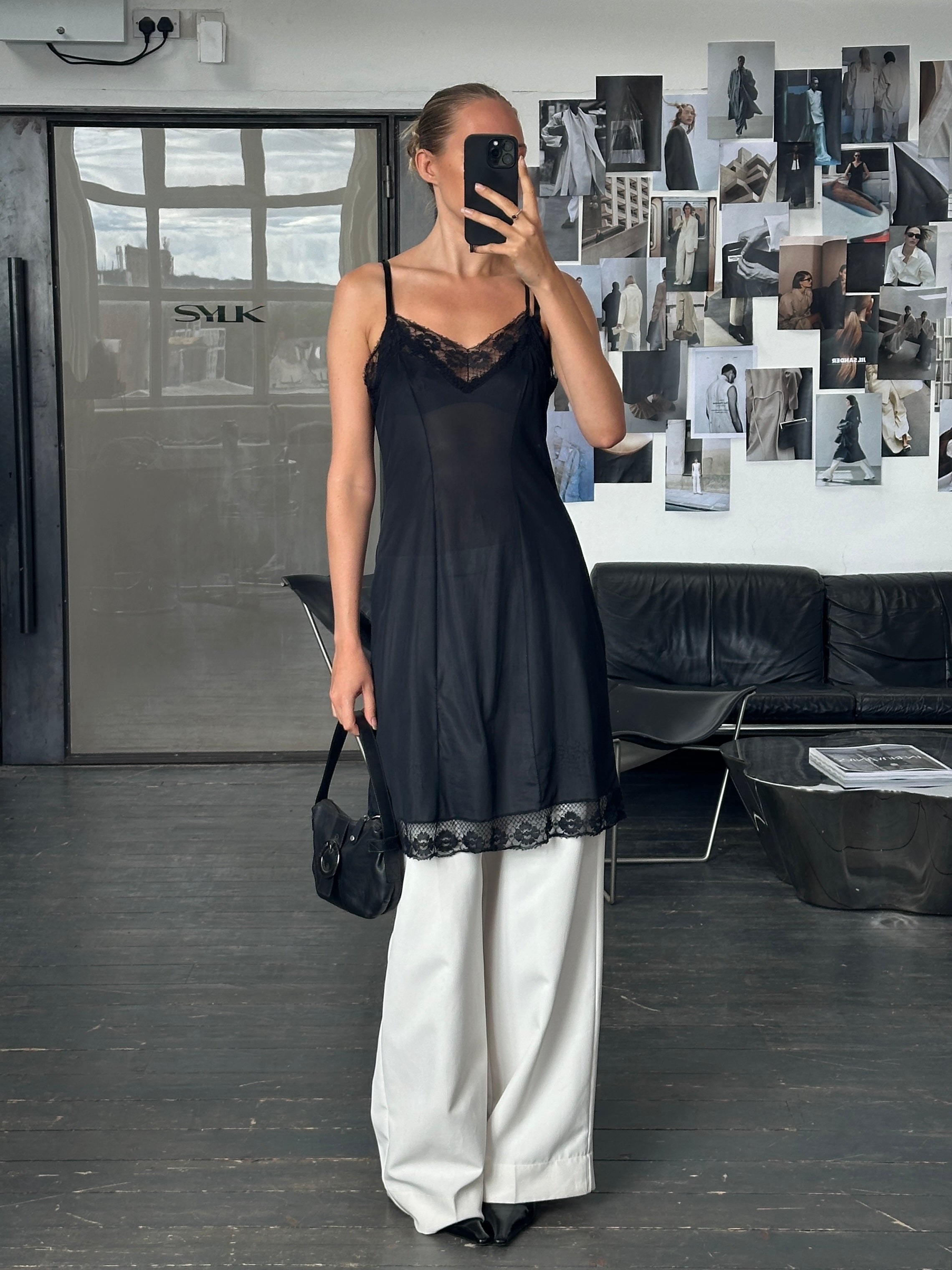 Vintage 1980s lace semi-sheer slip dress in size M, featuring delicate lace details and a classic vintage silhouette.