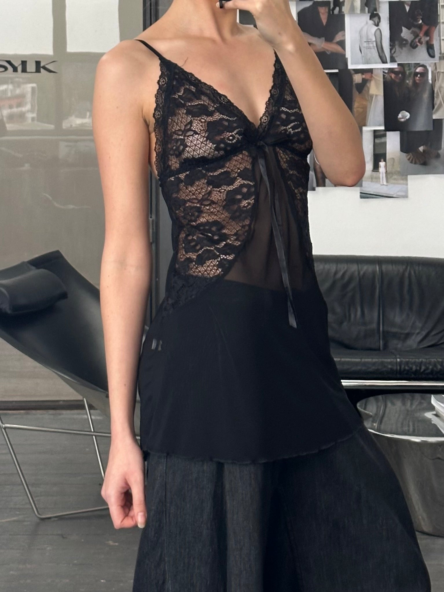 Vintage 1990s sheer lace top in size small, featuring delicate floral lace fabric and a classic feminine design.