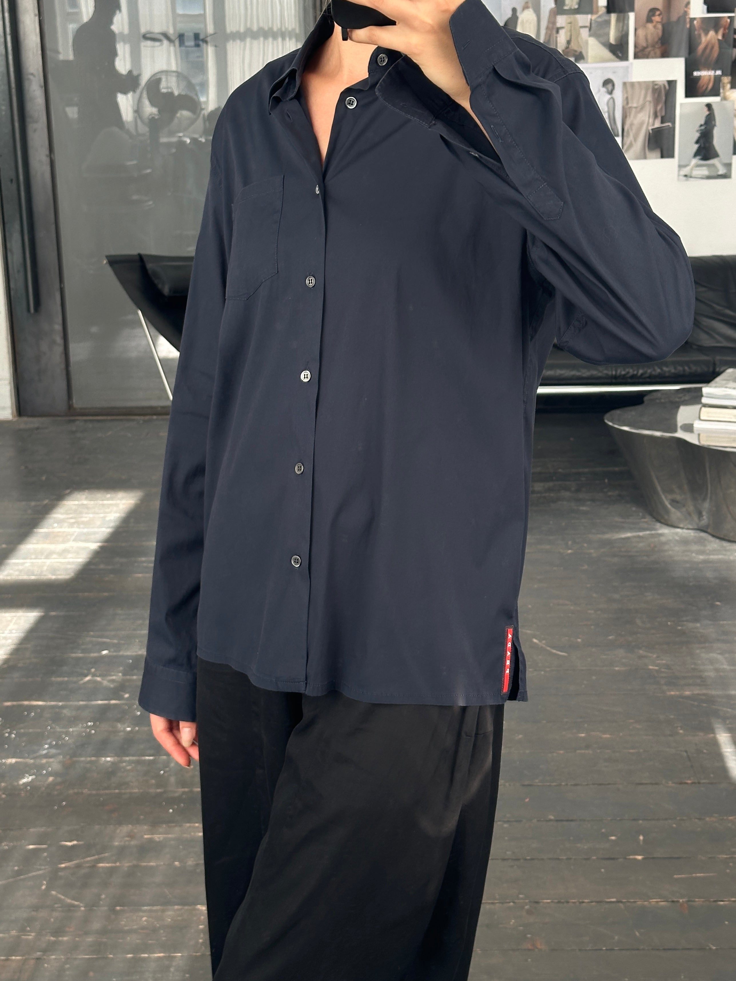 Prada 2000s cotton logo shirt in size M, featuring a classic design with the Prada logo on the front.
