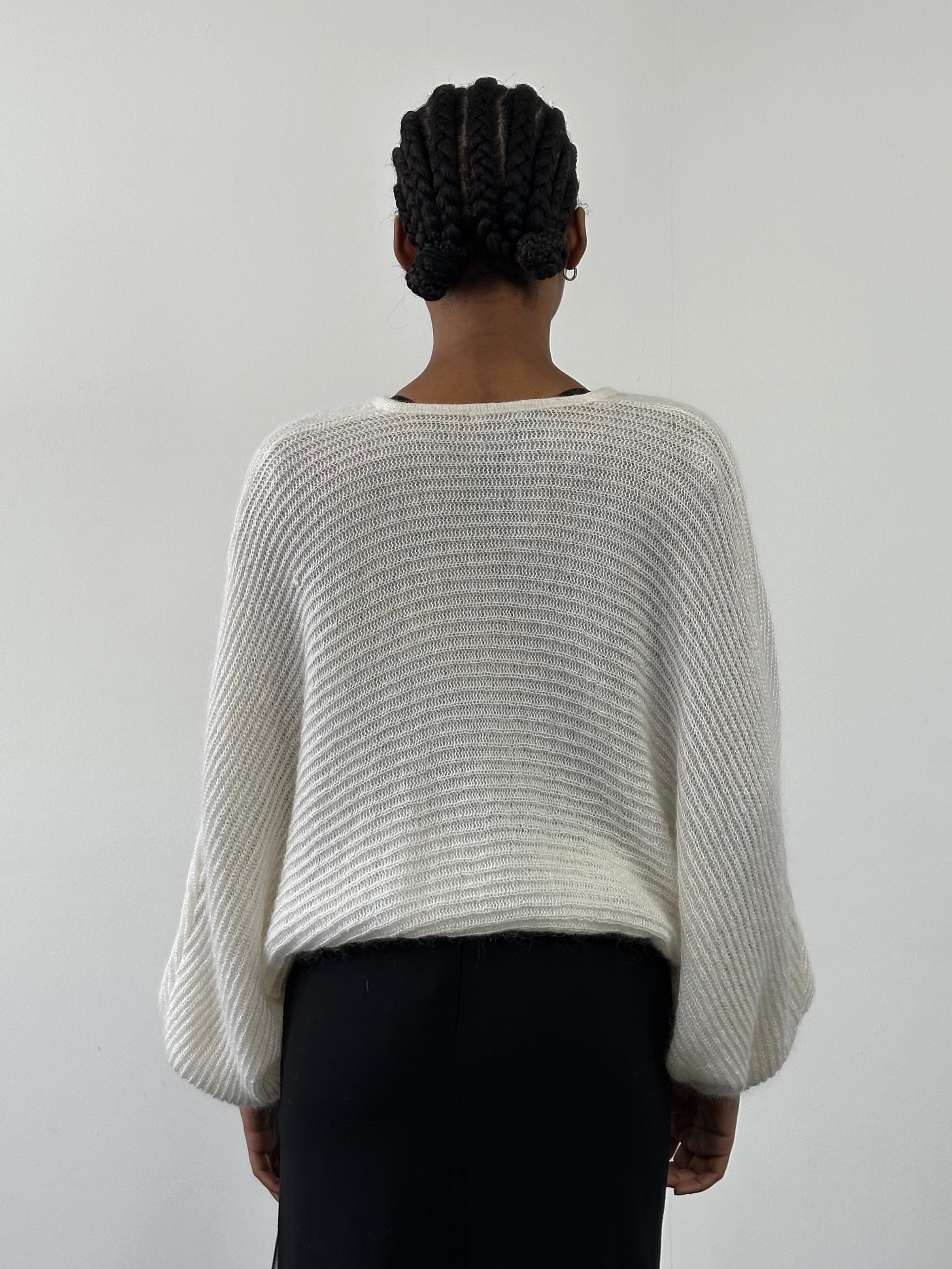 Vintage Italian mohair knitted cardigan from the 1990s, soft beige color, medium size, featuring a cozy, textured knit pattern.