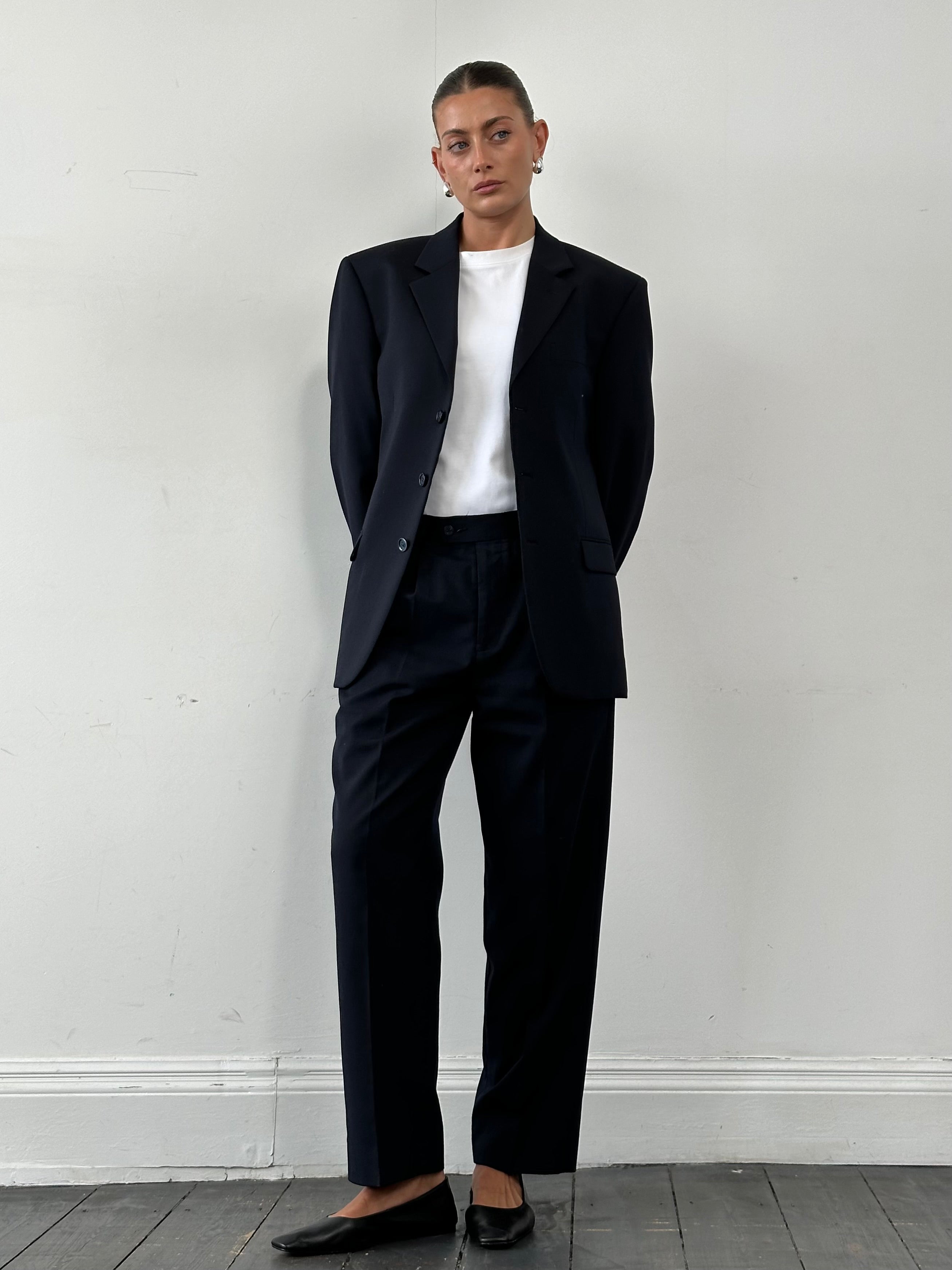 Vintage wool single-breasted blazer in size 38S/L, classic tailored design with notch lapels and button closure.
