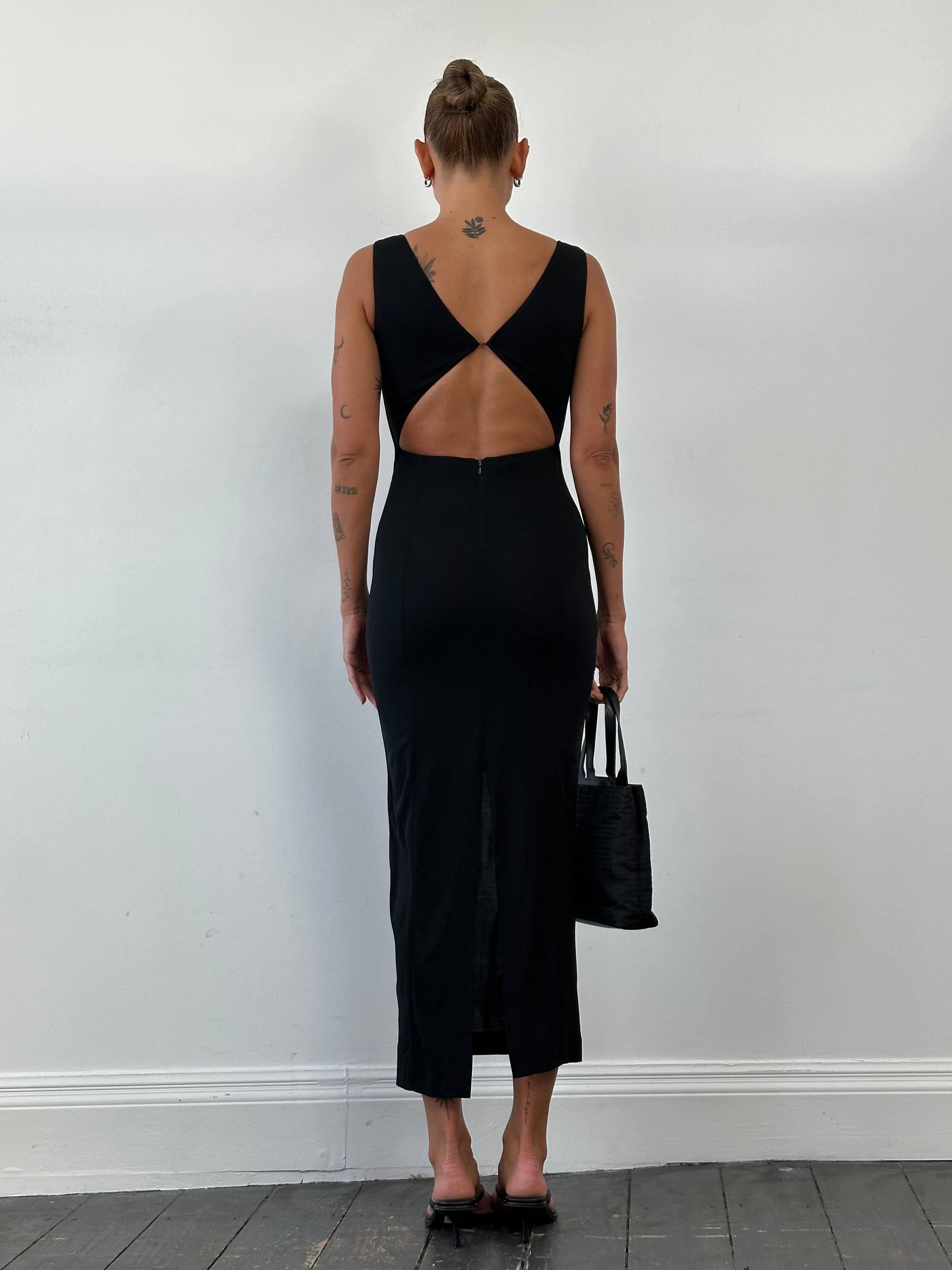 Italian Vintage cut-out maxi dress in size small, featuring elegant design and flowing fabric, perfect for stylish occasions.