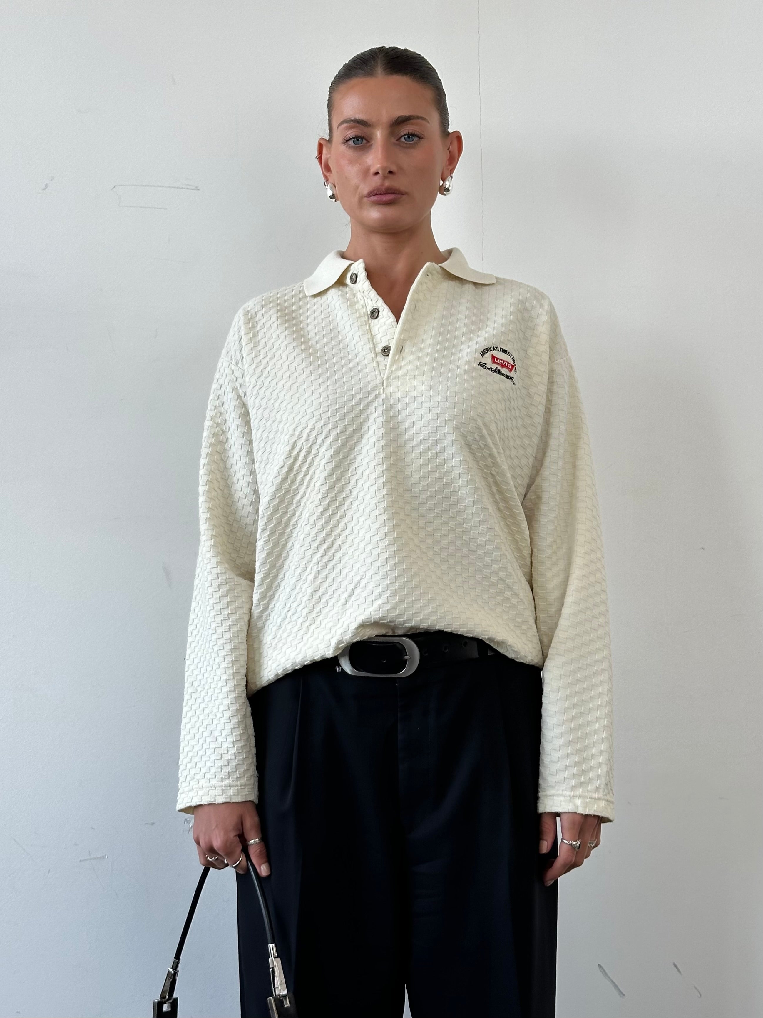 Levi’s pure cotton logo embroidery polo jumper in size L, featuring a classic collar and embroidered branding on the chest.