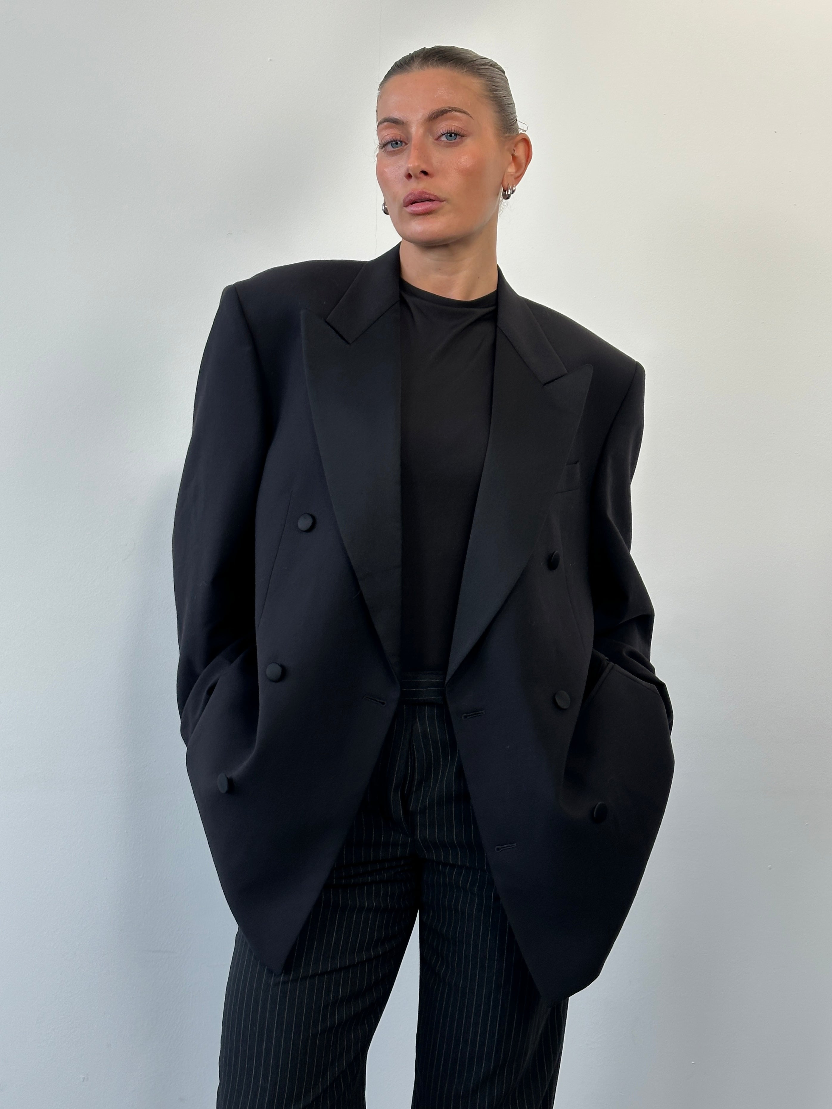 Gianfranco Ferre 1990s pure wool double-breasted tuxedo blazer in size 42R/XL, shown in classic black with peak lapels.
